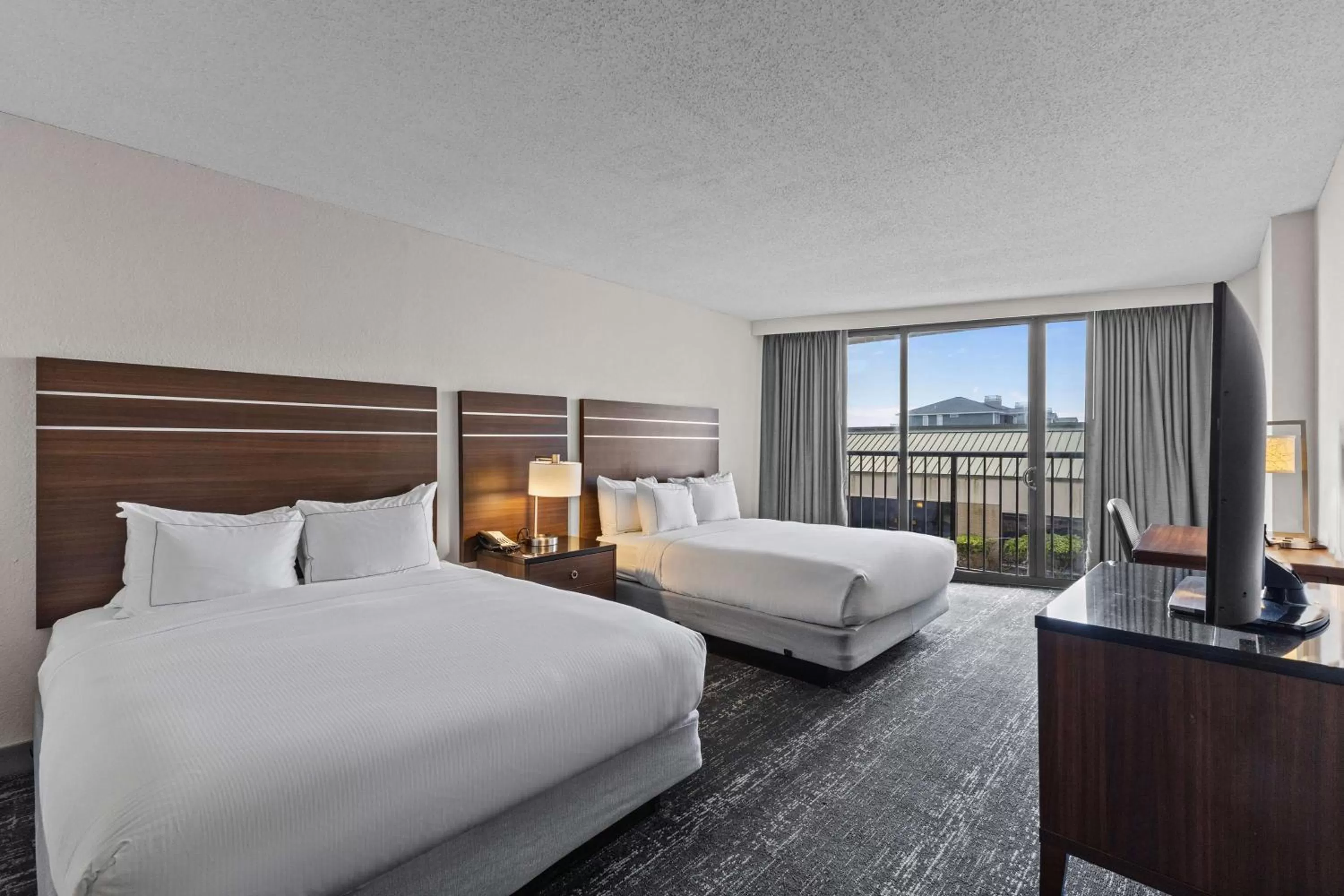 Bed in DoubleTree by Hilton Atlantic Beach Oceanfront