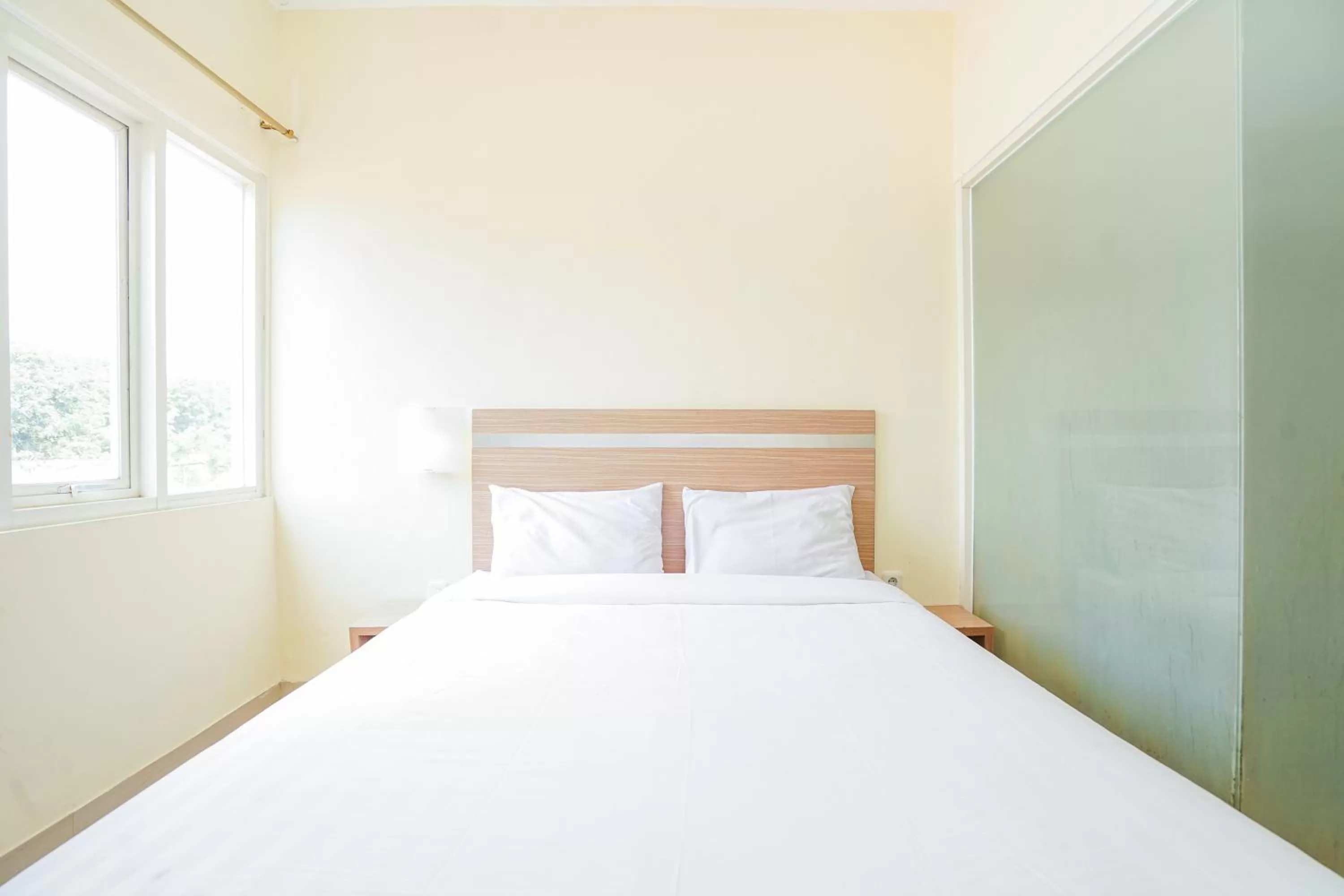 Bed in Pratisarawirya Guesthouse by ecommerceloka