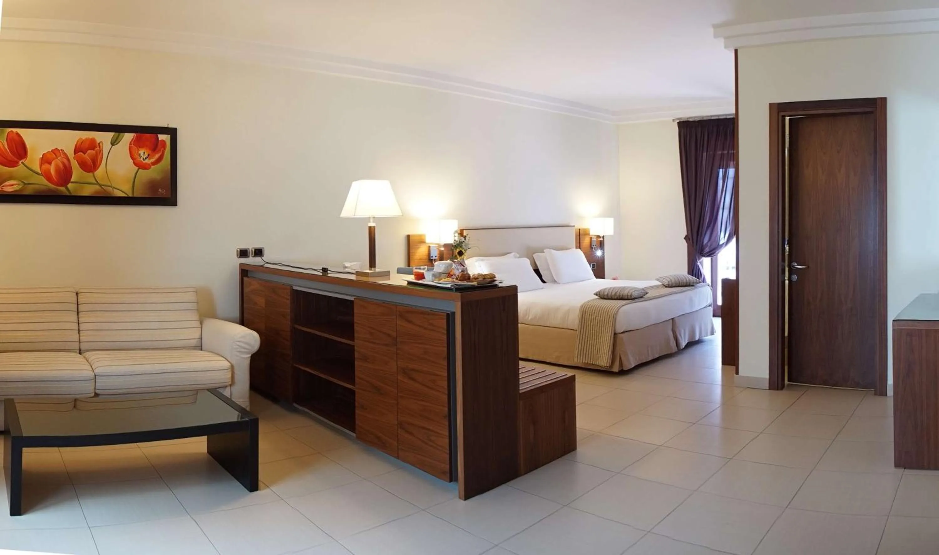 Bed in Suites & Residence Hotel