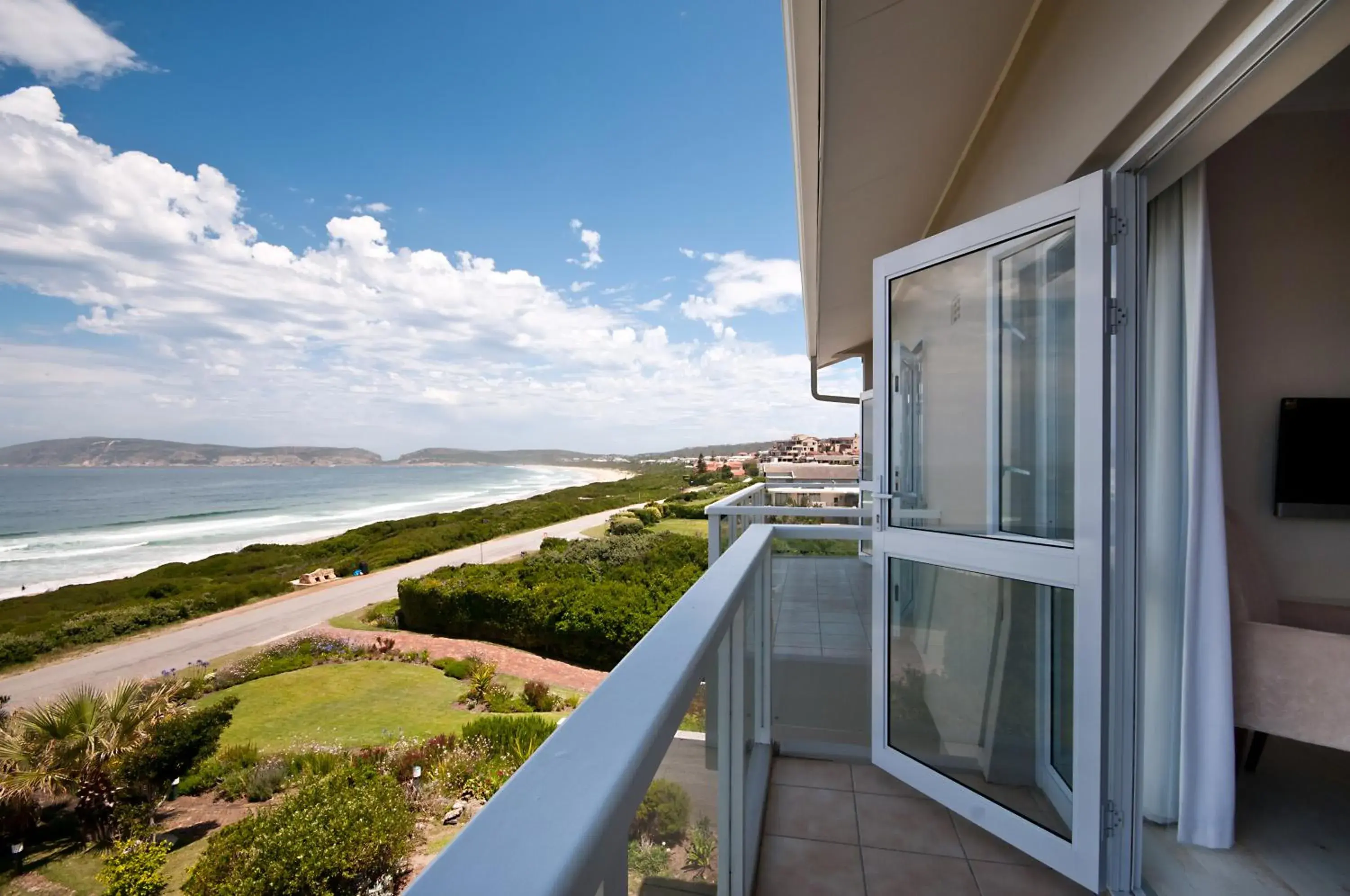 Sea View Suite with Balcony in The Robberg Beach Lodge - Lion Roars Hotels & Lodges Sea View Suite with Balcony in The Robberg Beach Lodge - Lion Roars Hotels & Lodges
