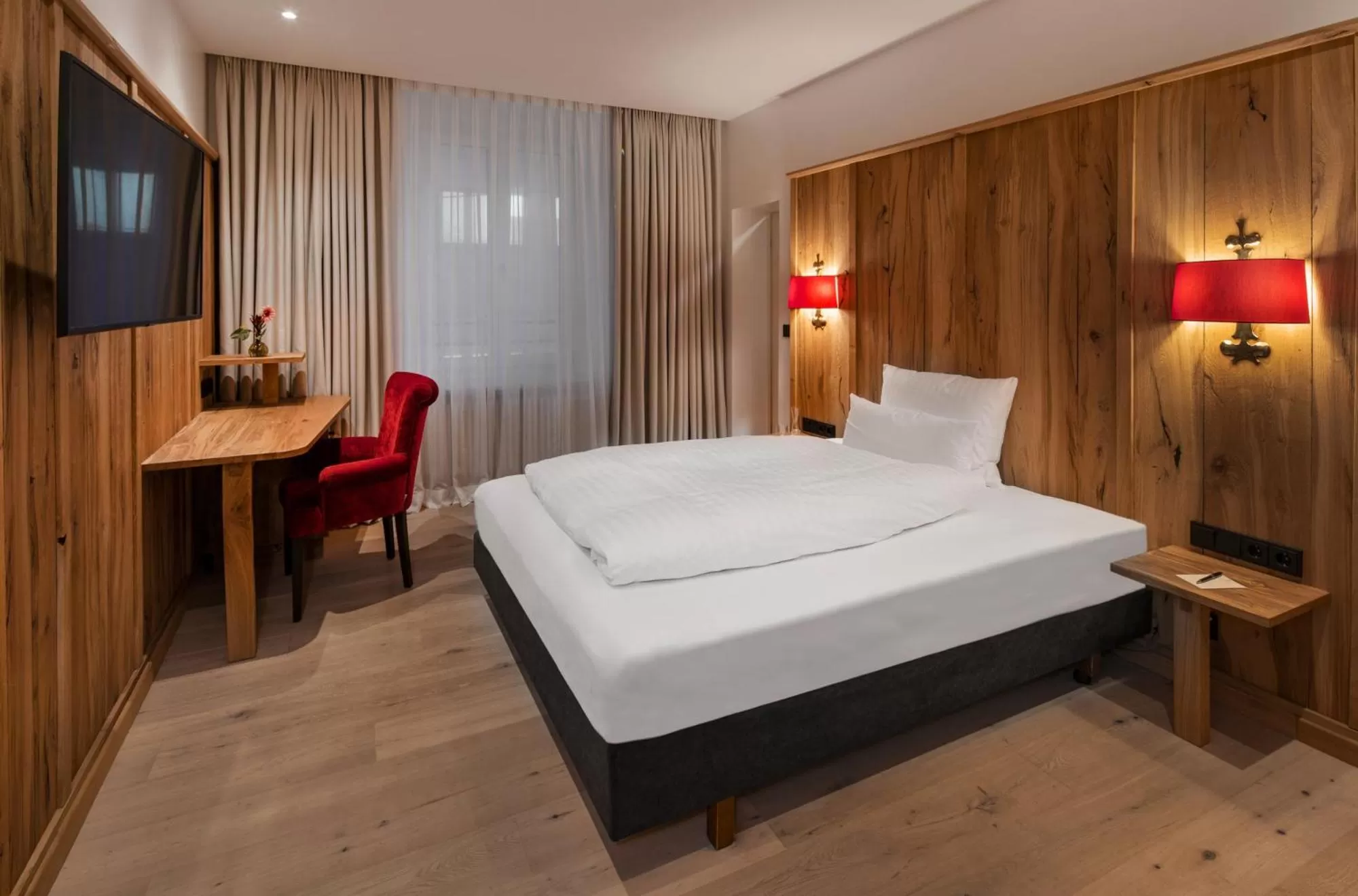 Bed in Eden Hotel Wolff