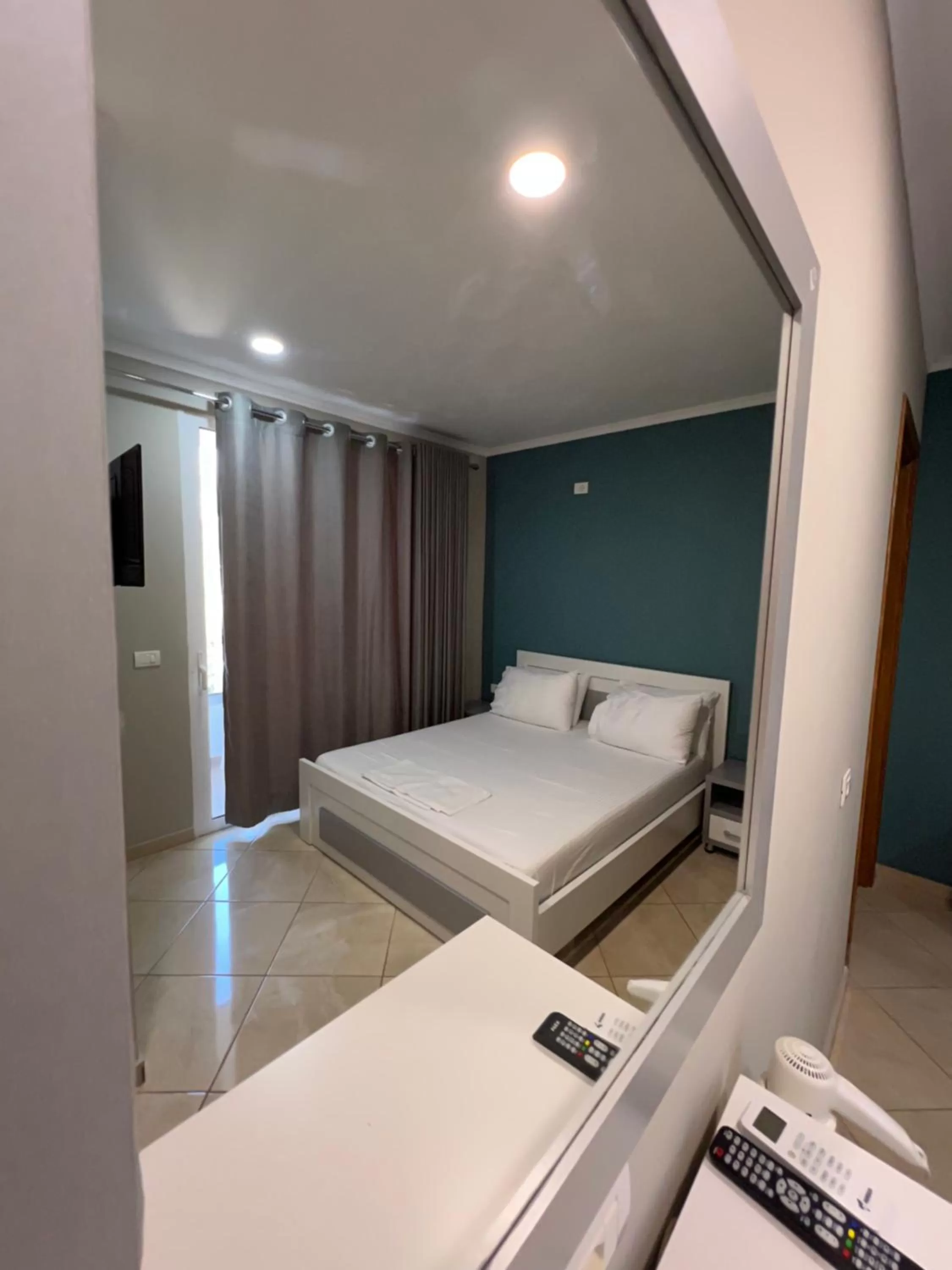 Communal lounge/ TV room, Bed in Aphrodite Garden Rooms & Apartment