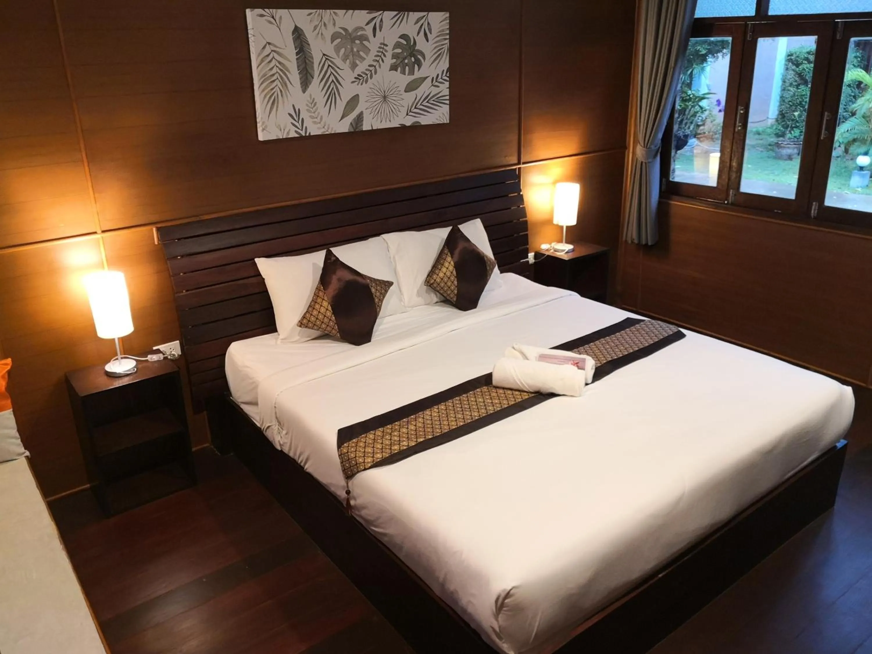 Bed in Baan Suan Rim Klong Resort