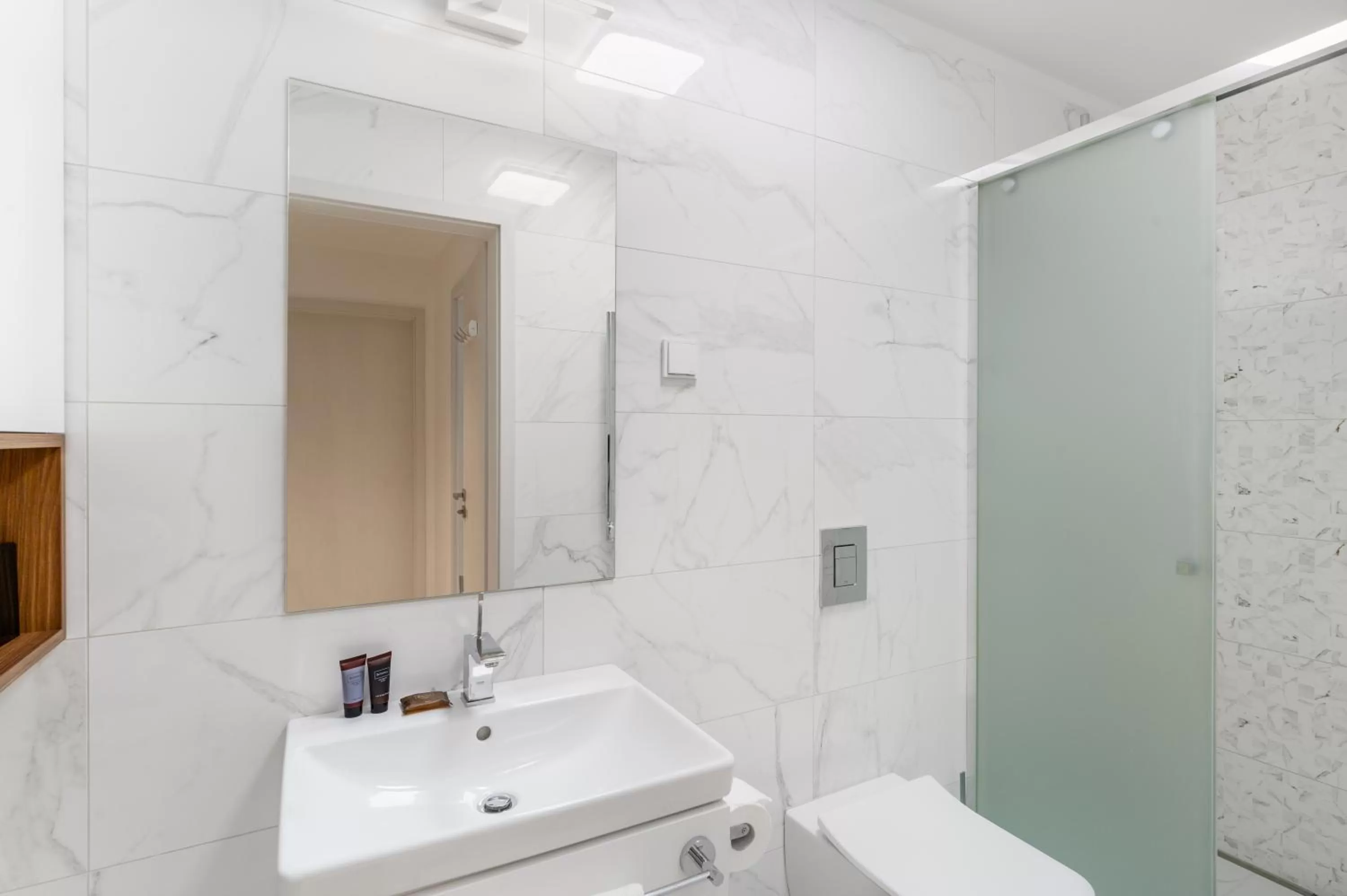 Shower in Emerald Downtown Luxury Suites by Continental Group