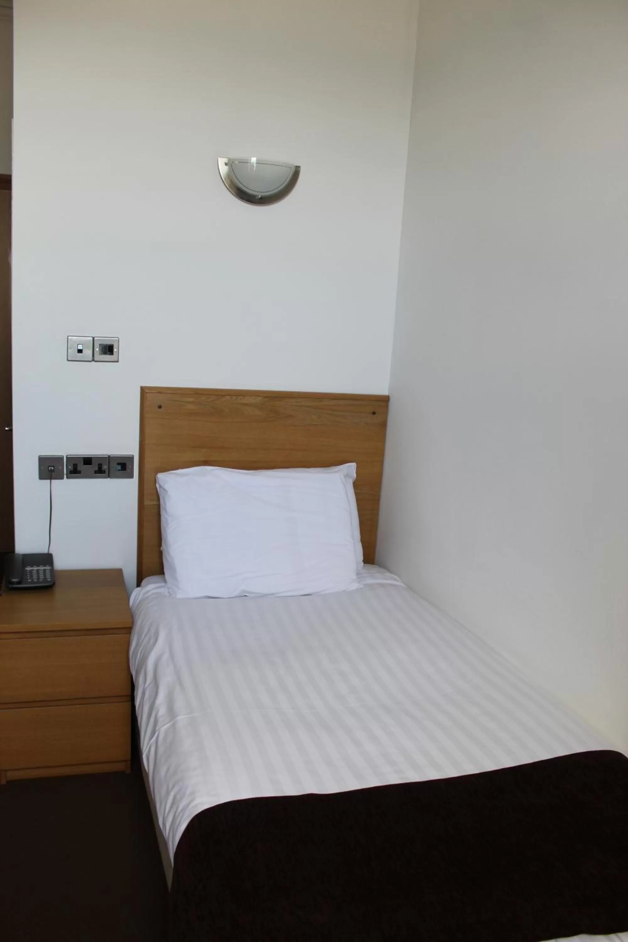 Bed in Four Saints Brig Y Don Hotel