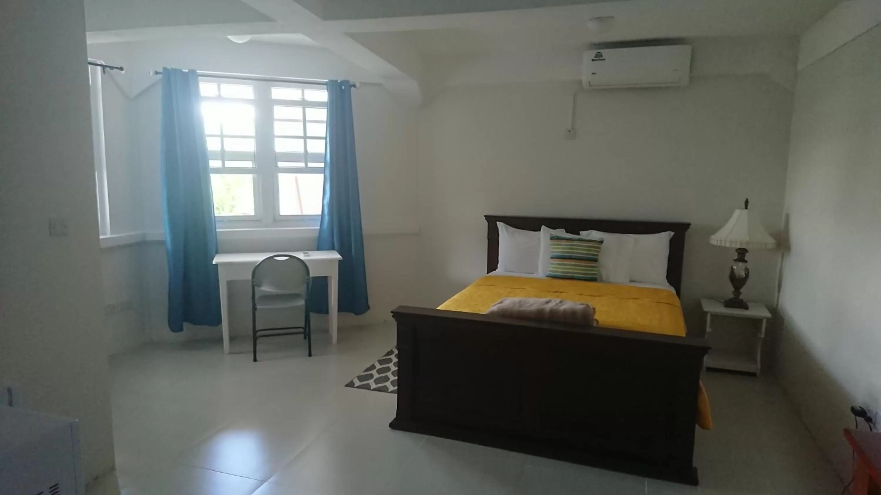 Bed in Classique International in Dominica