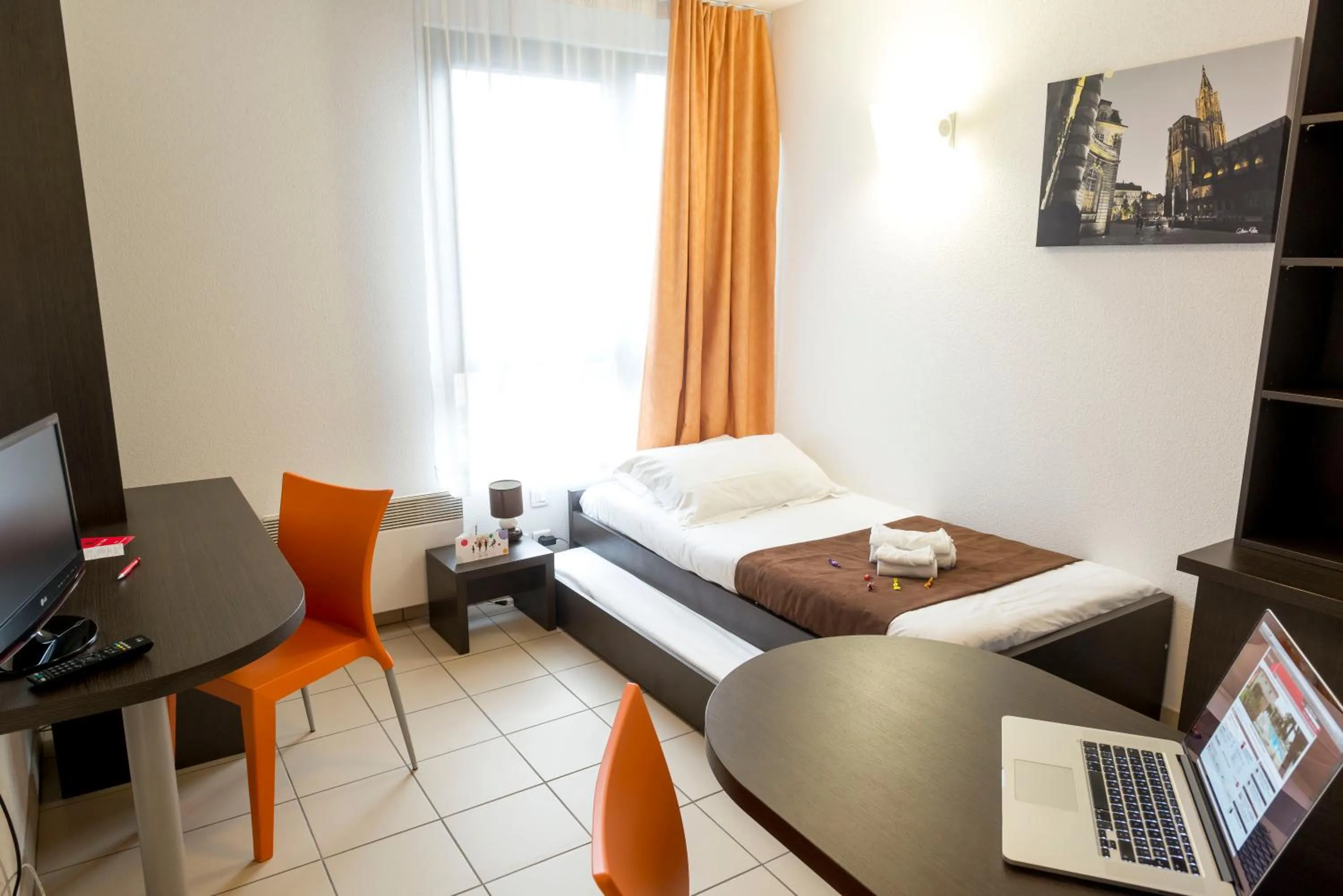 Photo of the whole room, Bed in Cerise Strasbourg Appart Hotel