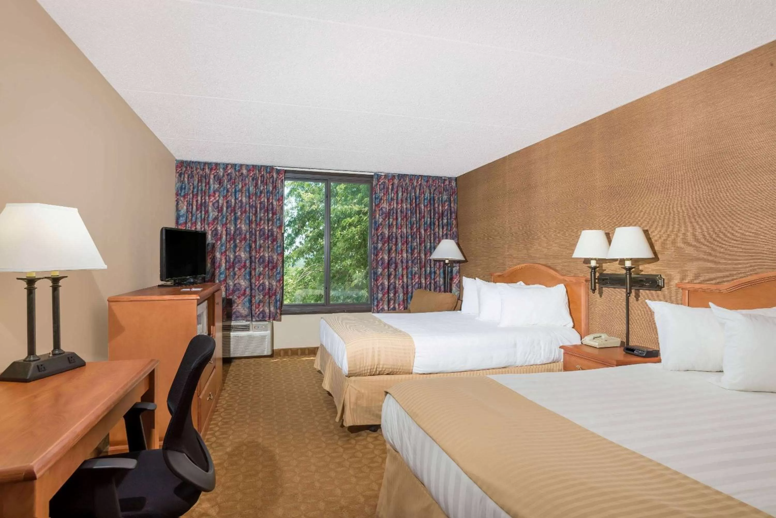 Photo of the whole room, Bed in Ramada by Wyndham Watertown Thousand