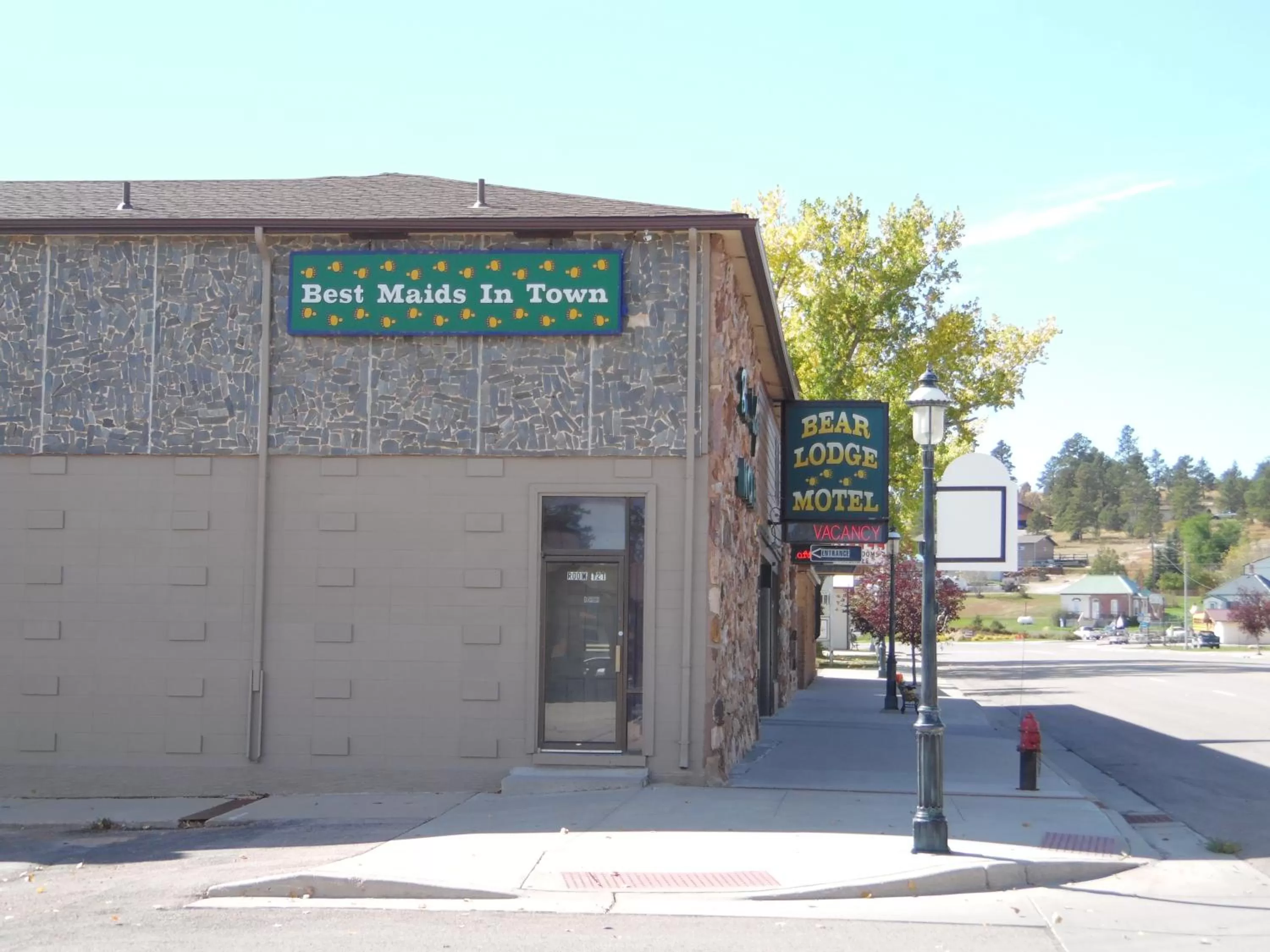 Property logo or sign in Bear Lodge Motel