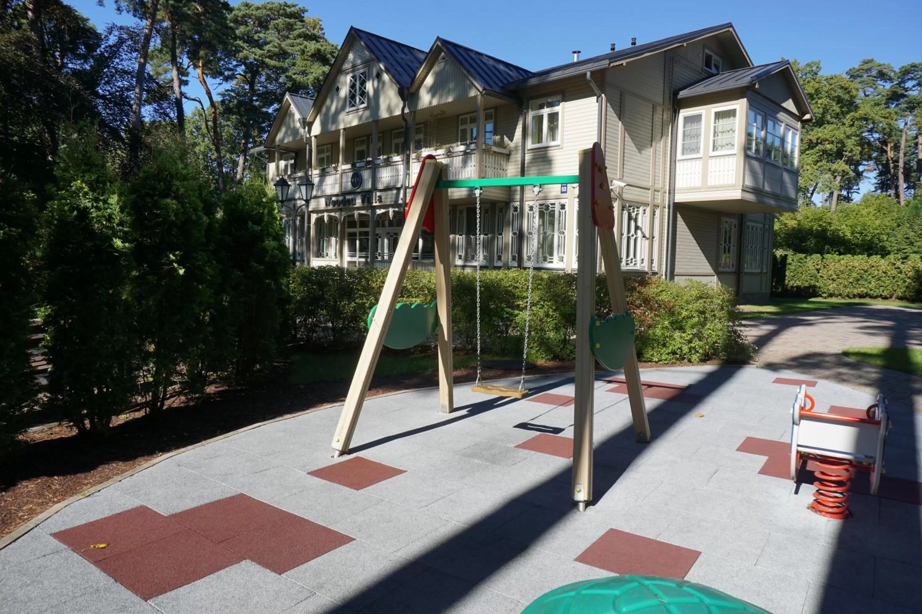 Property logo or sign in Wooden Villa APARTMENTS