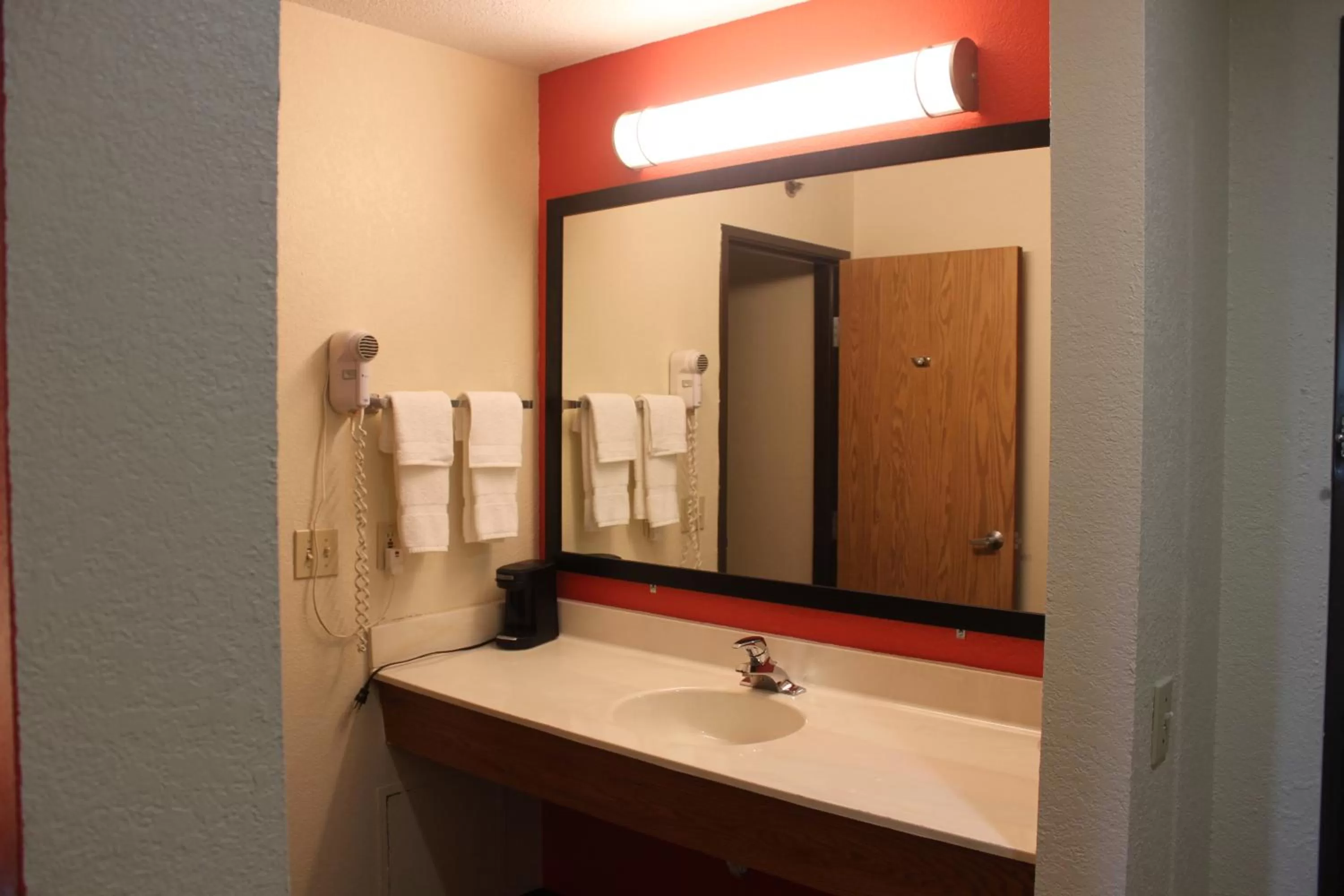 Bathroom in AmericInn by Wyndham West Burlington