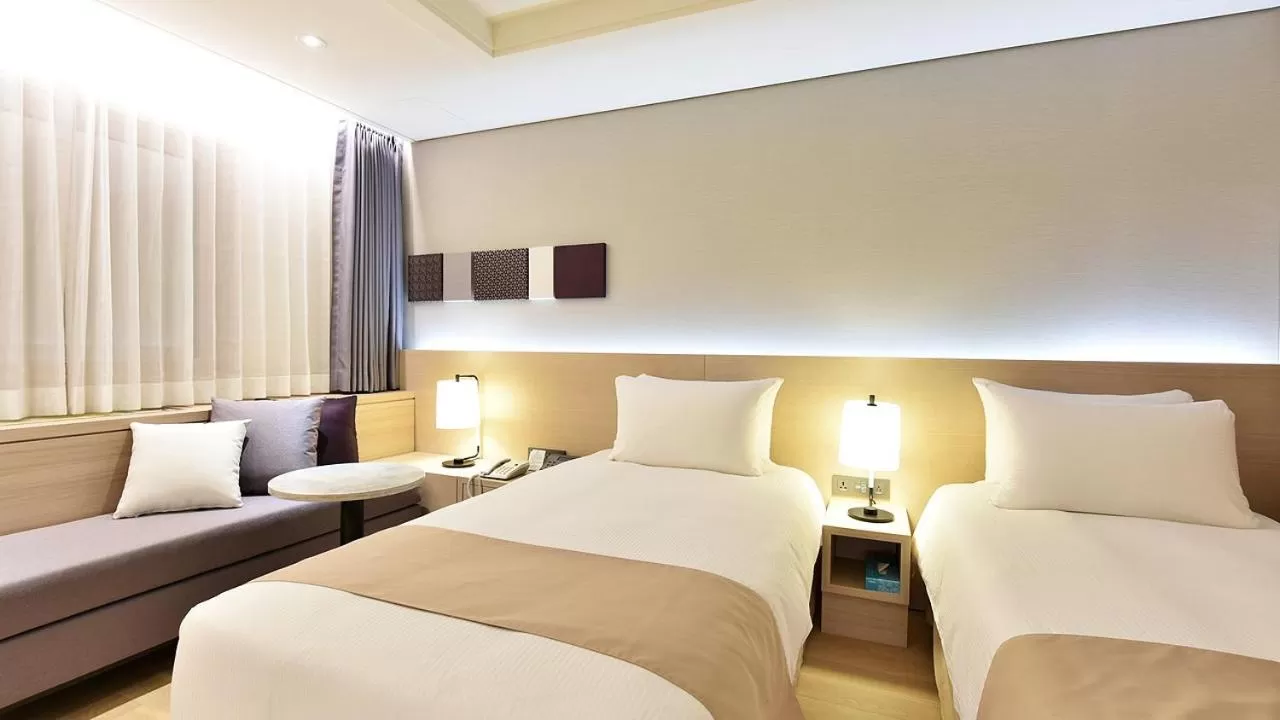 Bed in Pacific Hotel