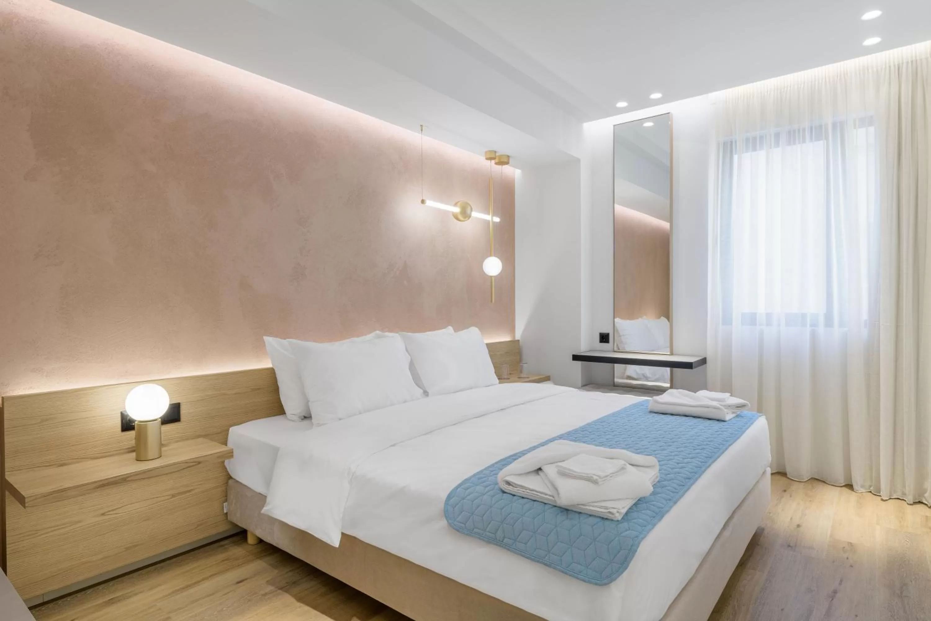 Bed in Acropolis Magenta Luxury Suites