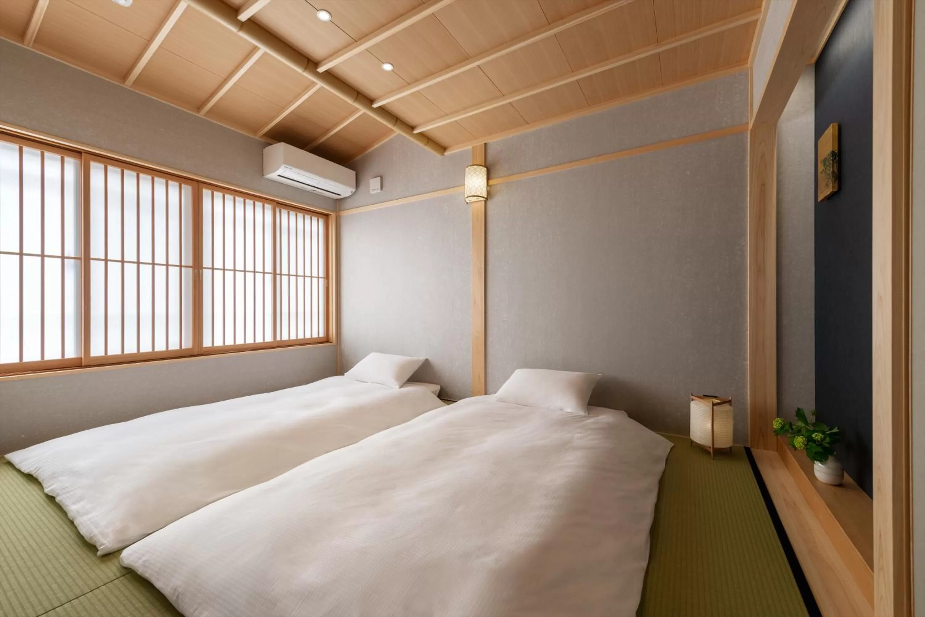 Bed in THE MACHIYA HOTEL TAKAYAMA