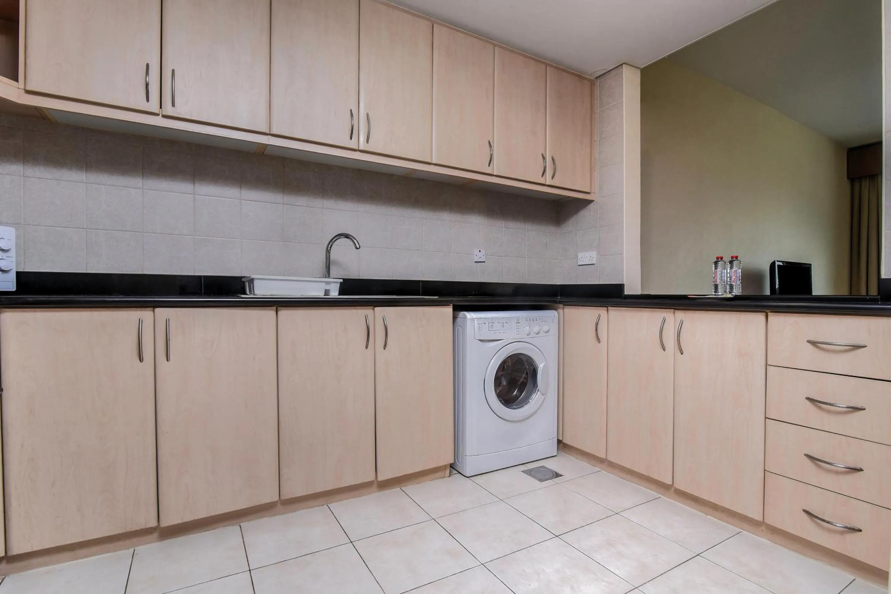 Kitchen or kitchenette in Parkside Hotel Apartment