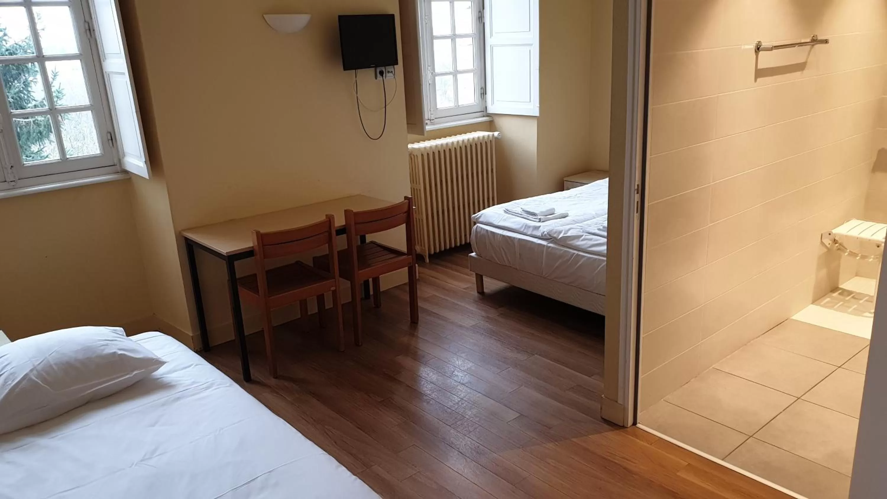 Bed in Hôtellerie Saint Yves