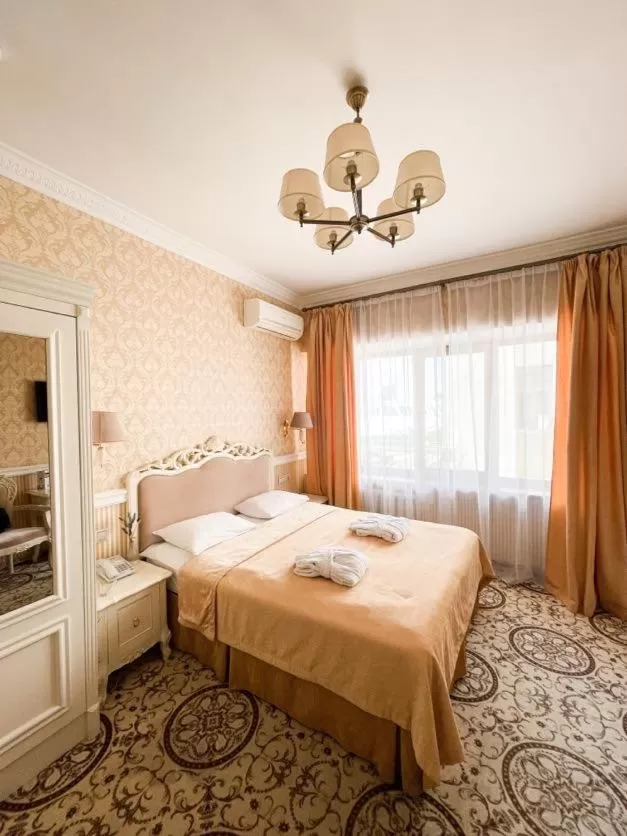 Bed in Royal Olympic Hotel