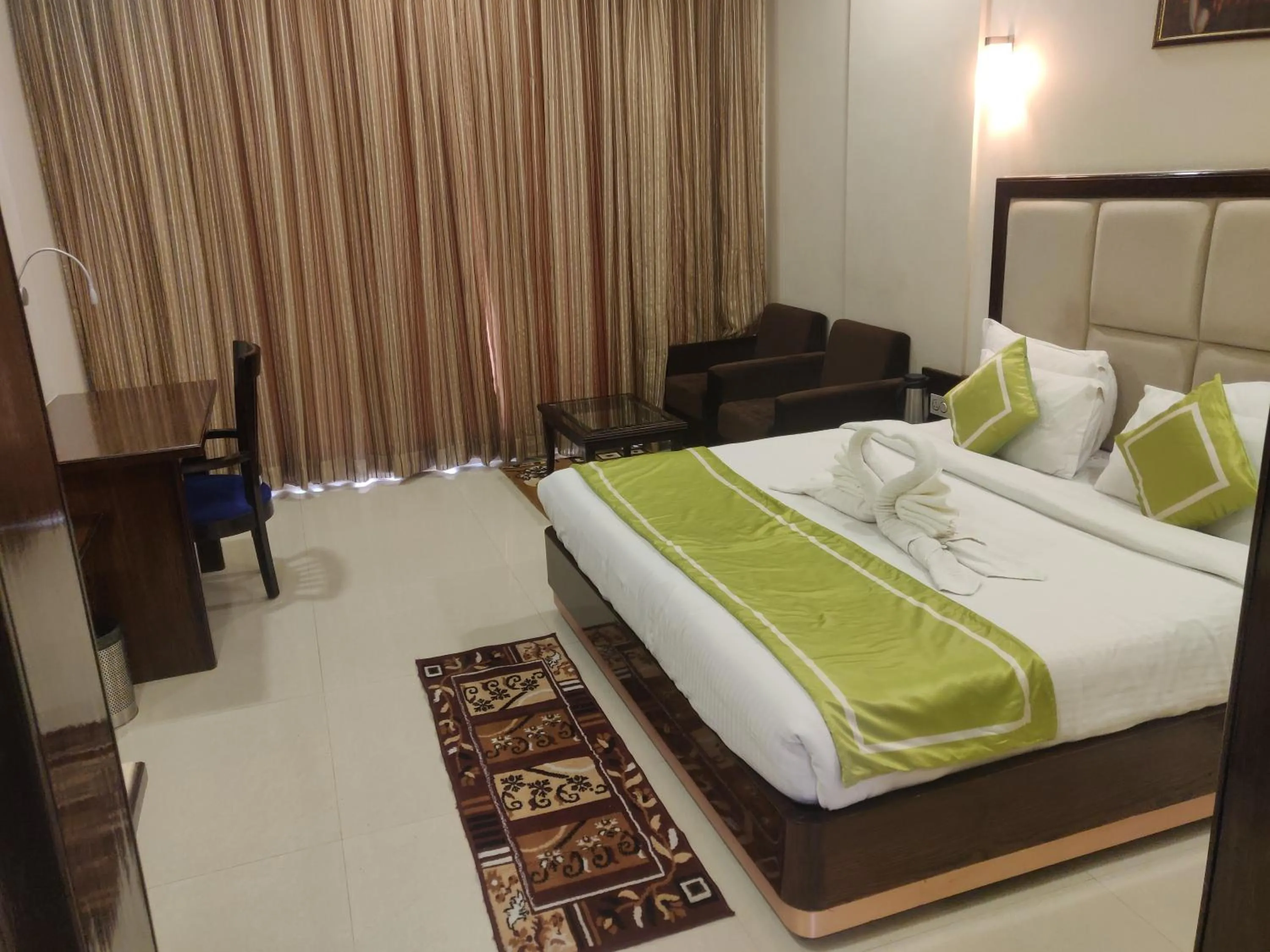 Seating area, Bed in Chandra Imperial