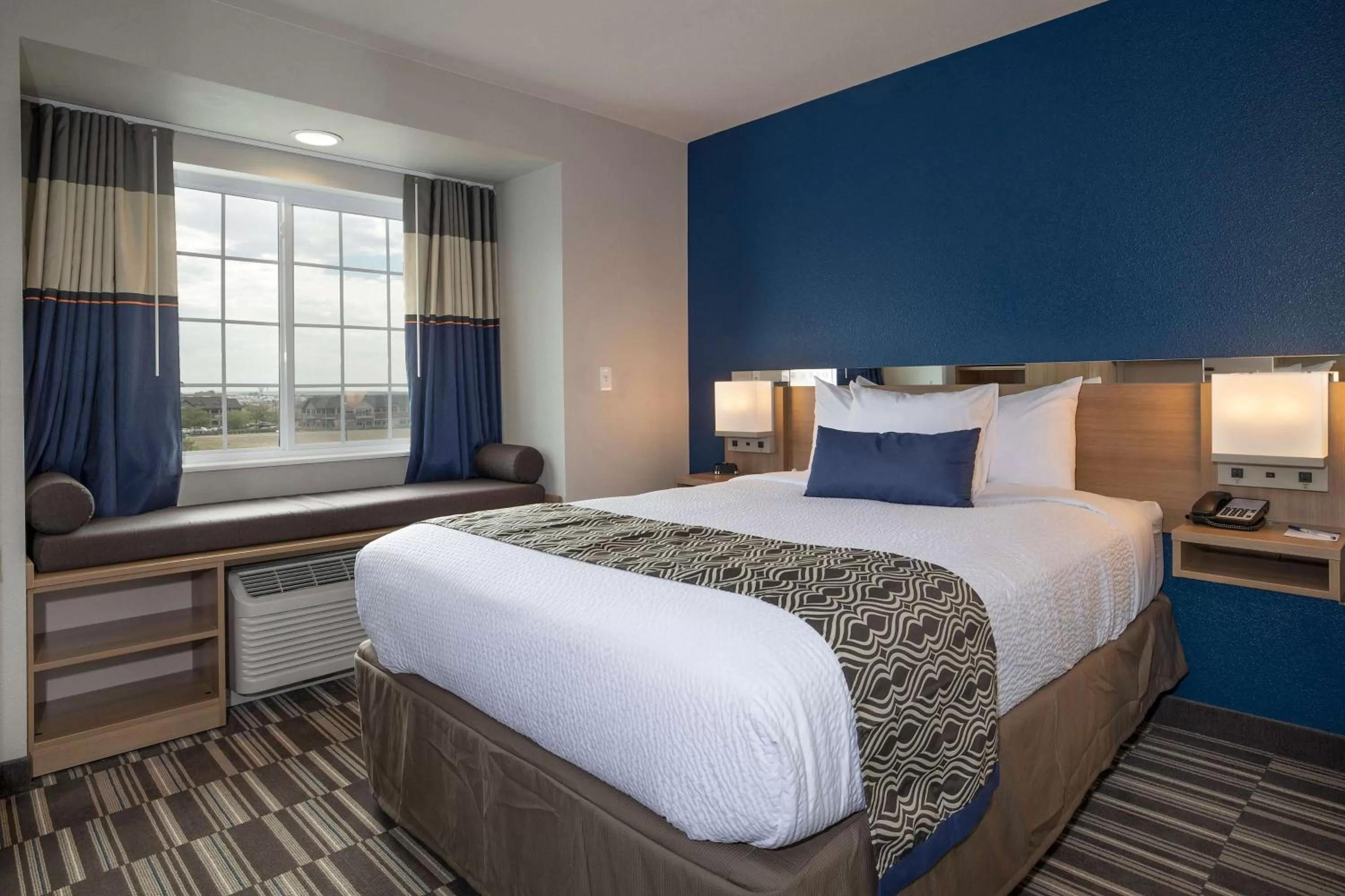 Bed in Microtel Inn & Suites by Wyndham Loveland