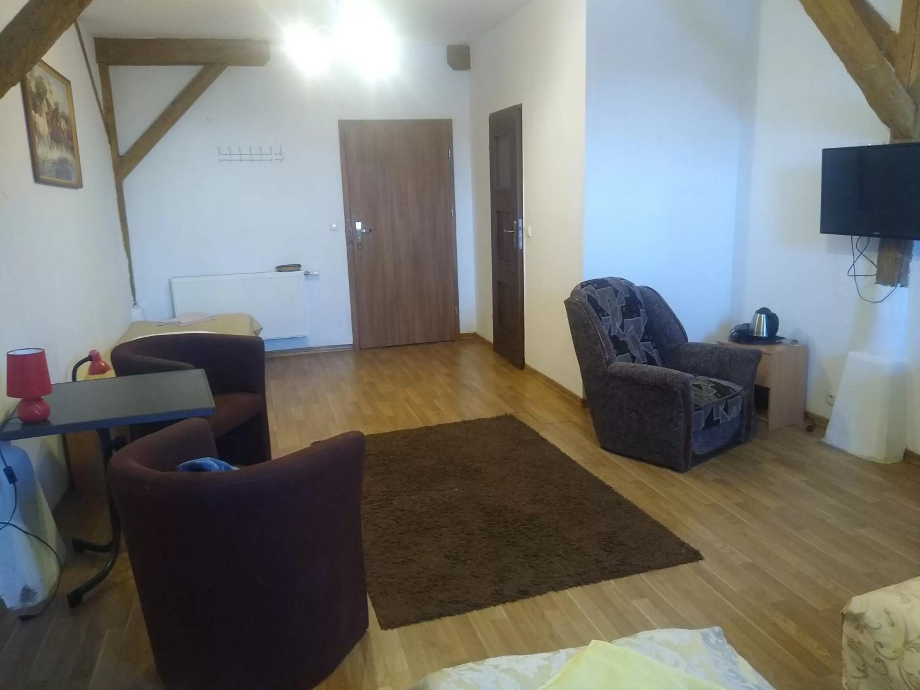 Communal lounge/ TV room, Seating Area in Zajazd Eljan-Centrum Noclegowe