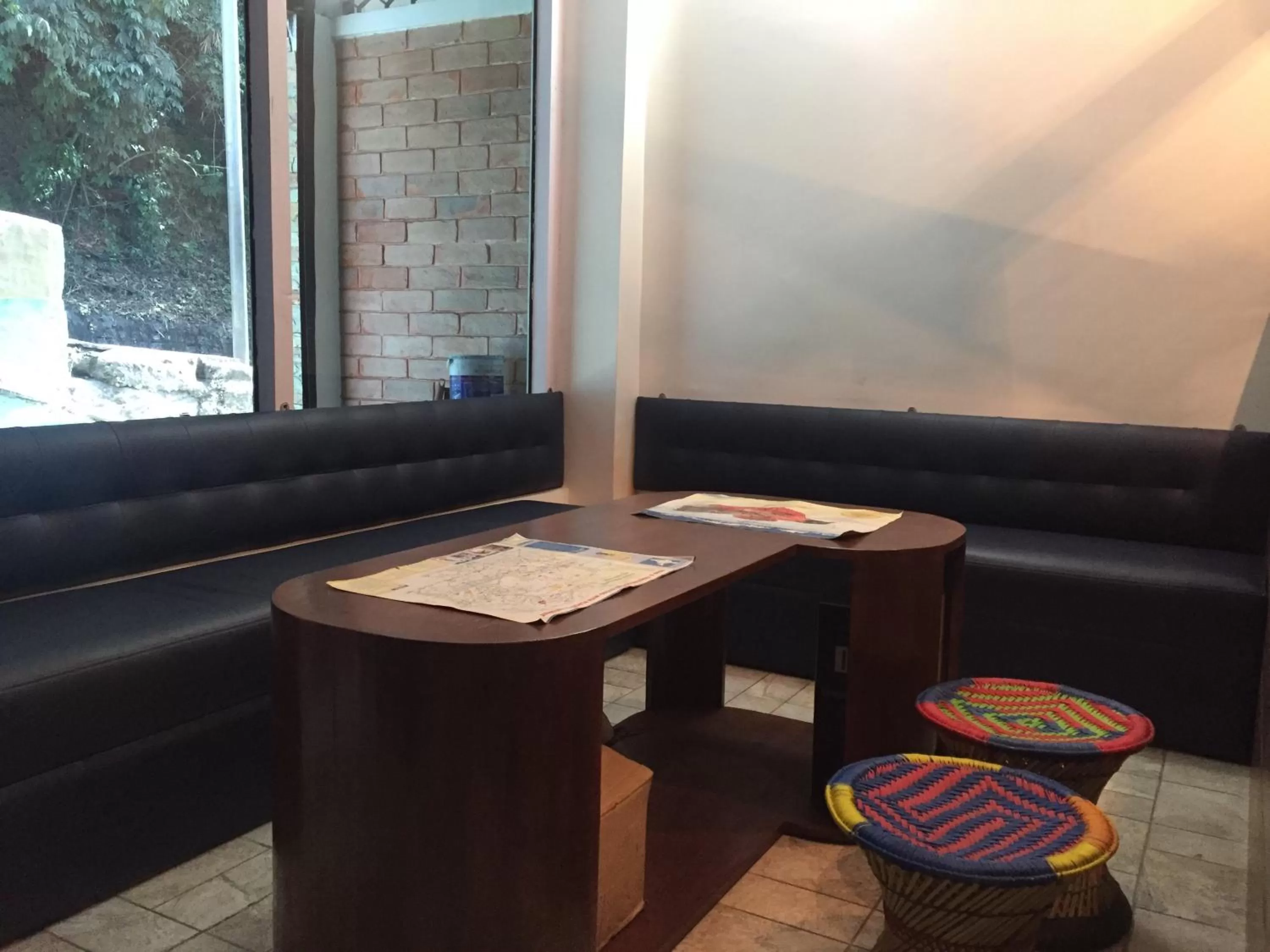 Seating area in Sleepy Sam -The Traveller’s Hostel