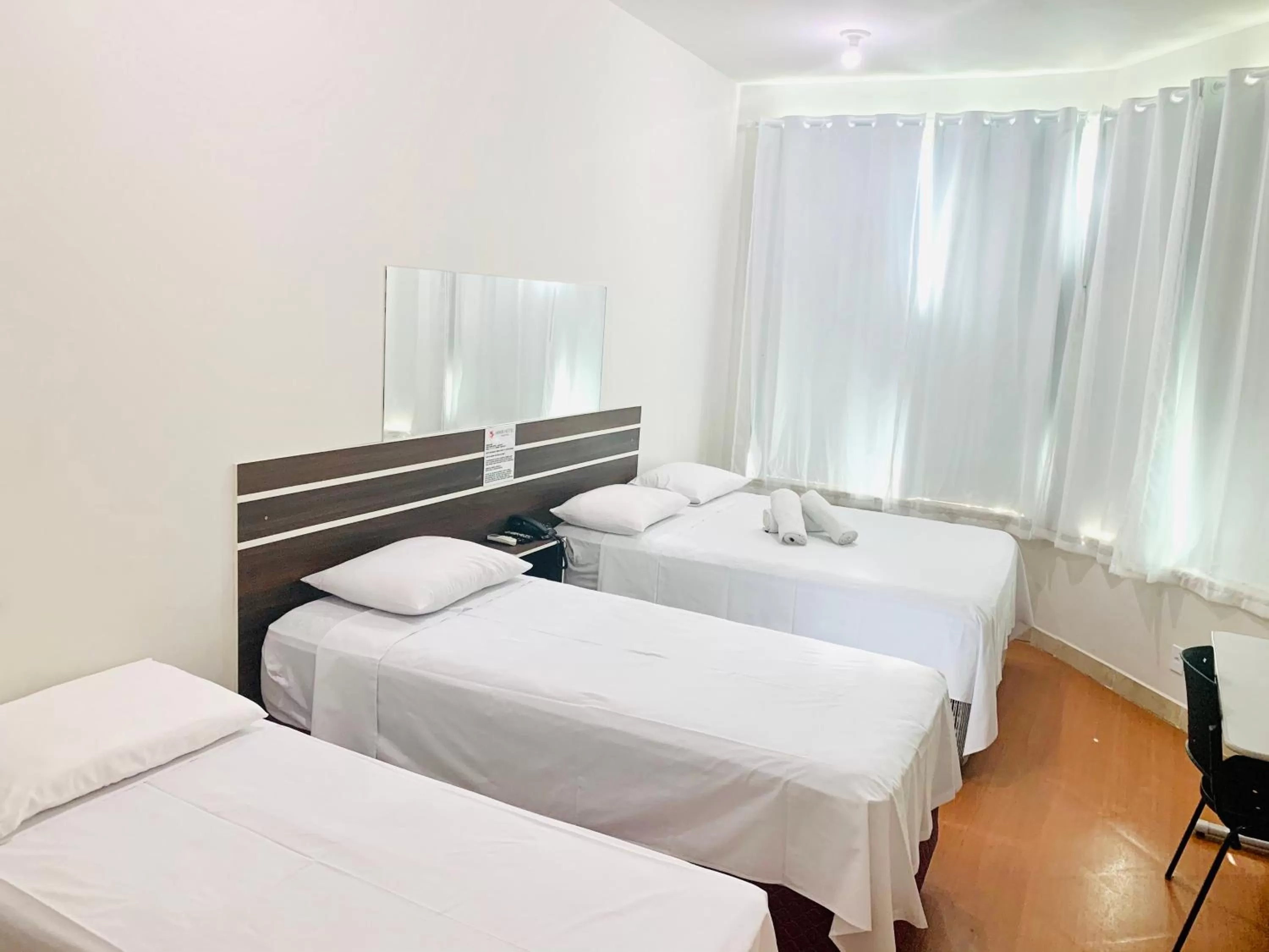 Bed in SAMIR HOTEL COMFORT