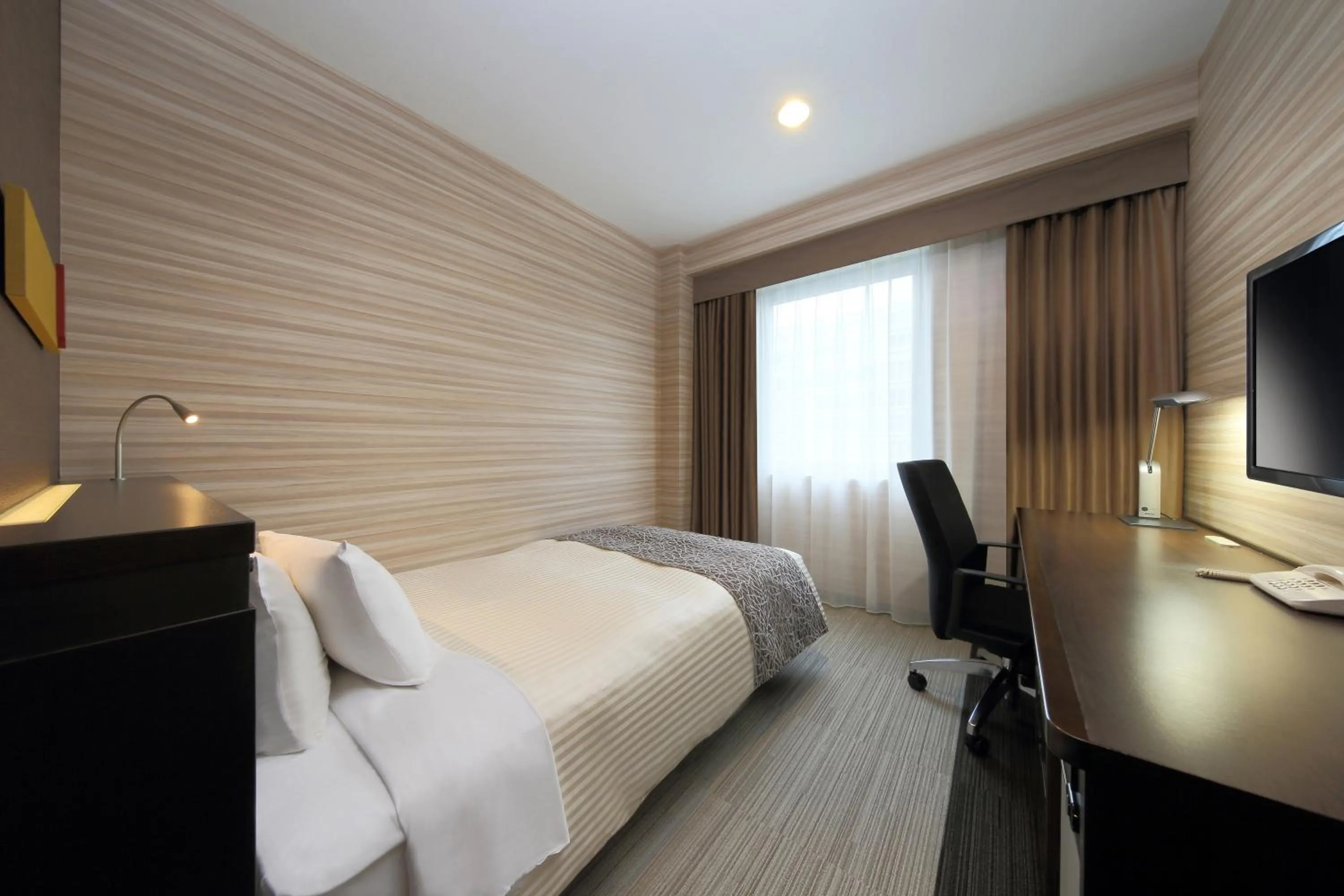 Photo of the whole room, Bed in JR-East Hotel Mets Fukushima