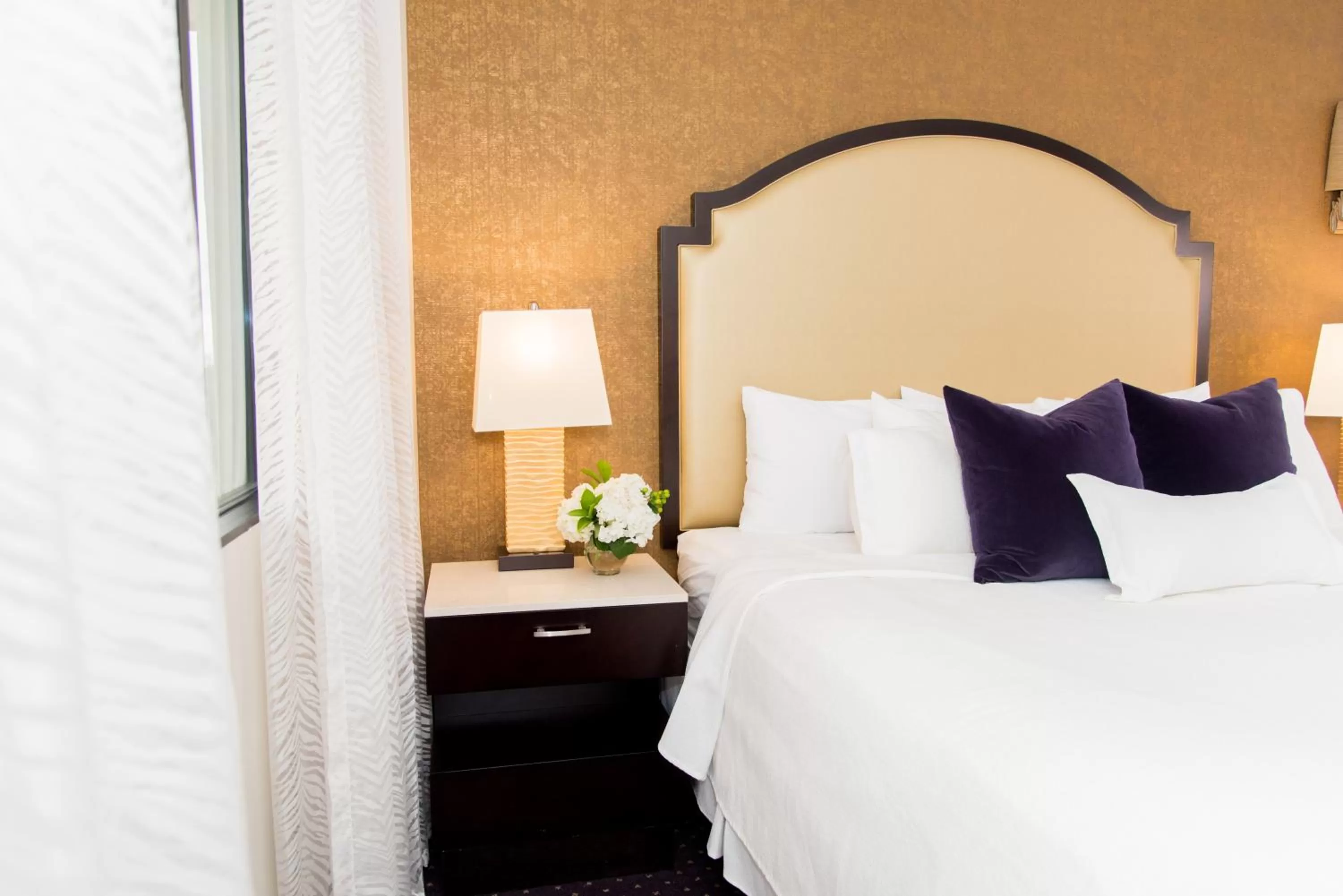 Bed in The Cook Hotel and Conference Center at LSU