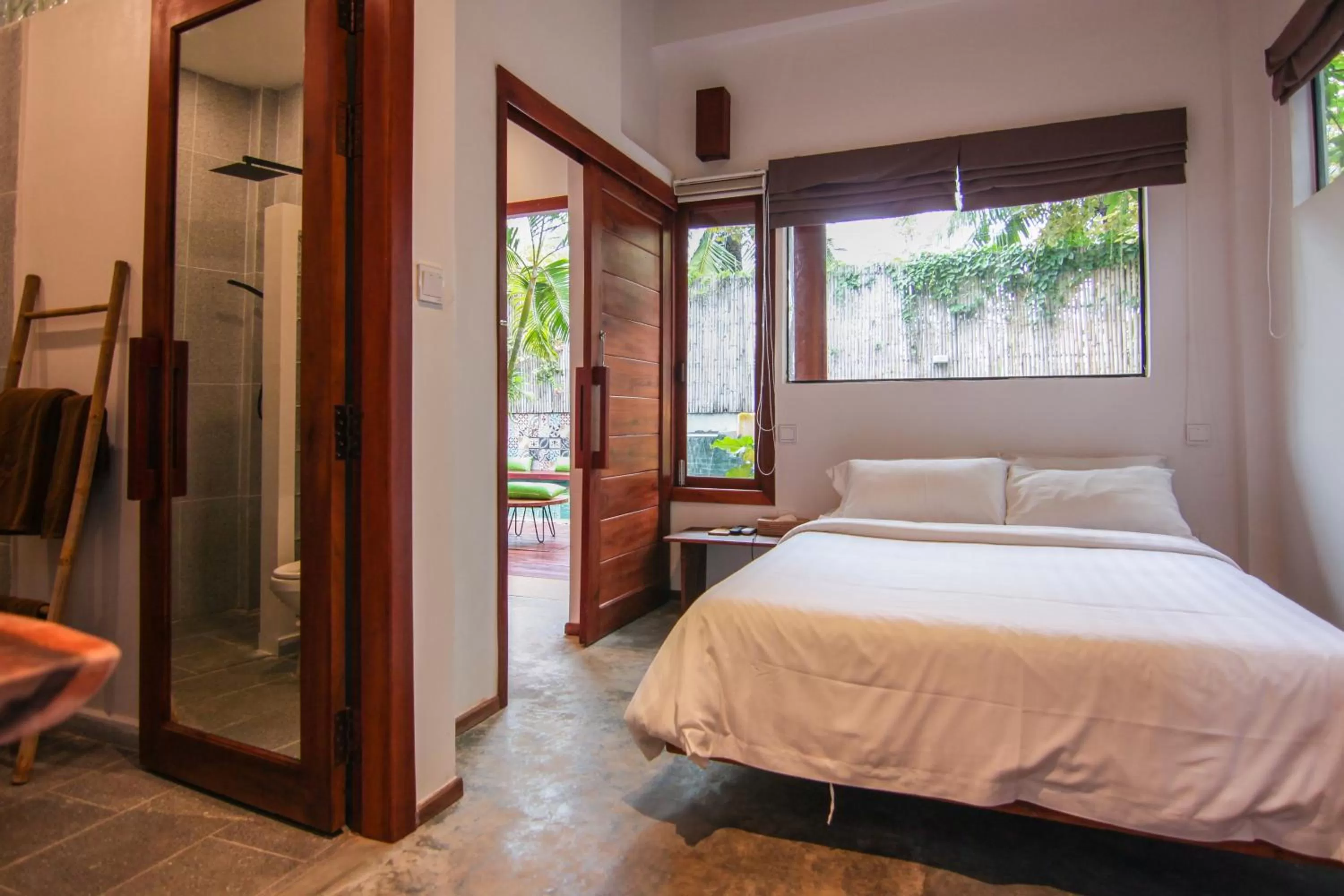 Bed in Sarina Hotel & Villa