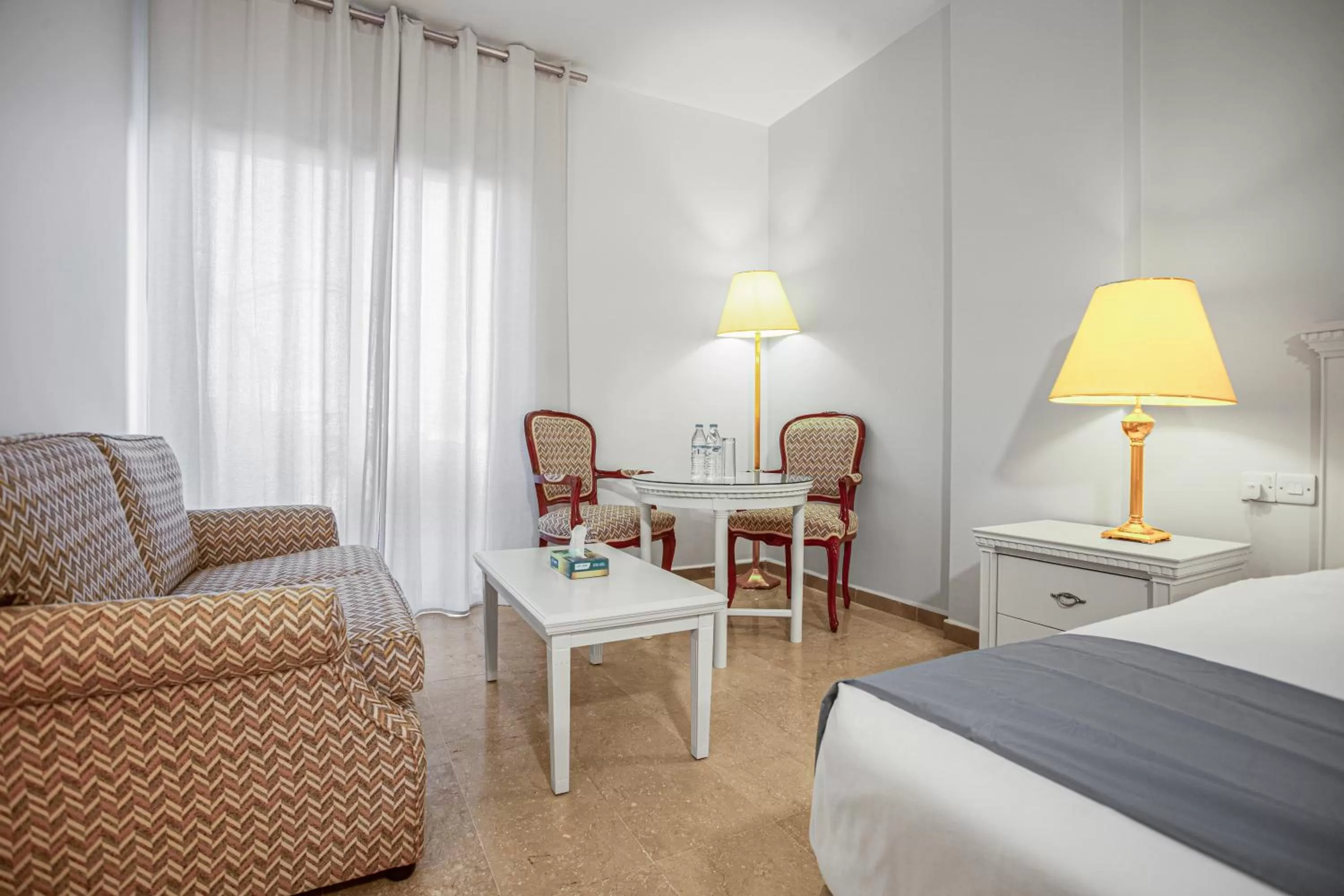 Living room, Bed in Grand Hotel Madaba