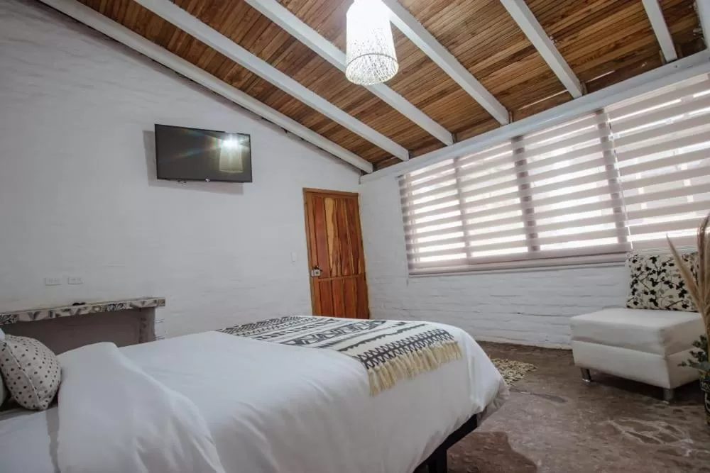 Bed in Rústic Hotel Quinta La Aurora