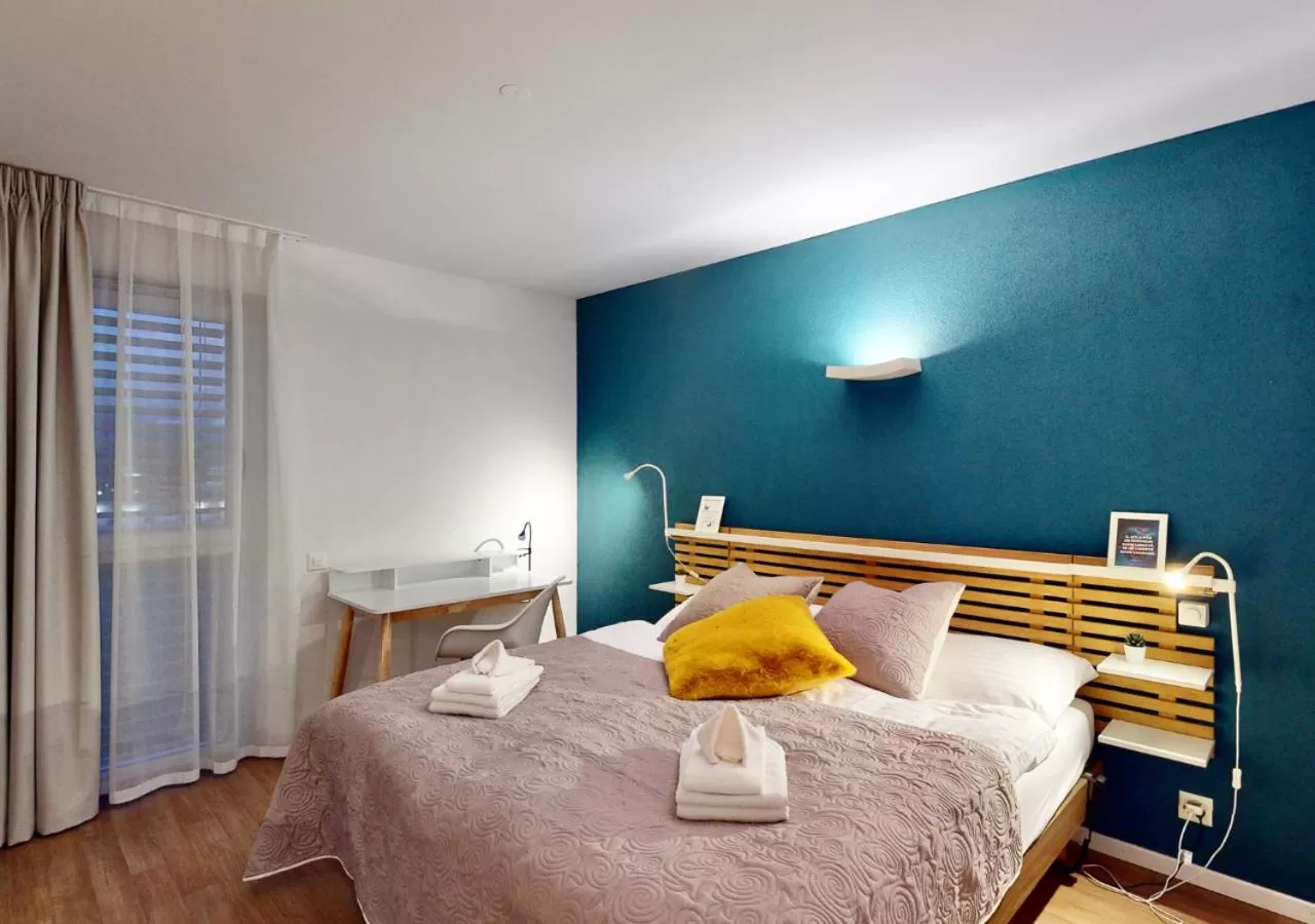 Bed in Alp Art Hotel Monthey