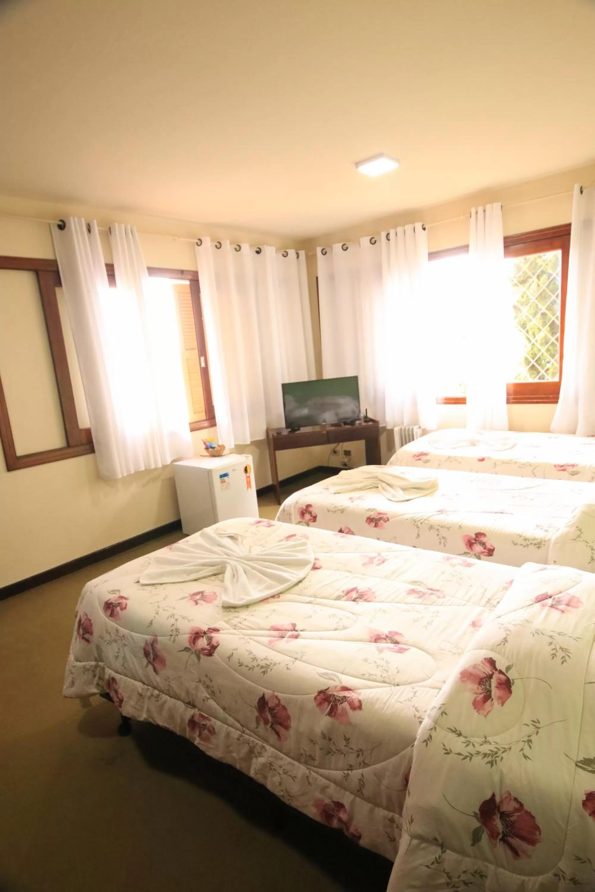 Bed in Pousada Curumi