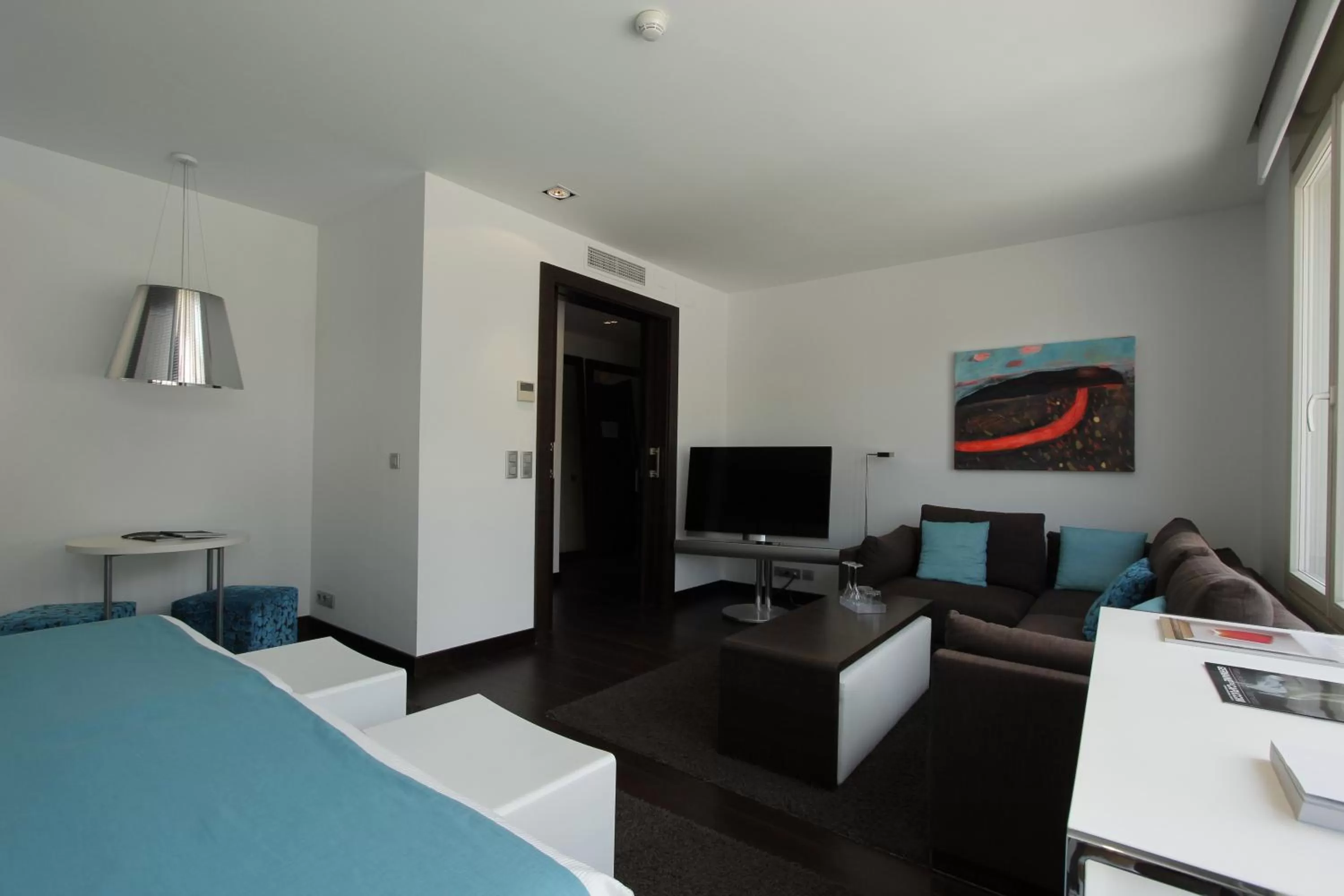 Bed, TV/Entertainment Center in Hotel Ferrero - Singular's Hotels