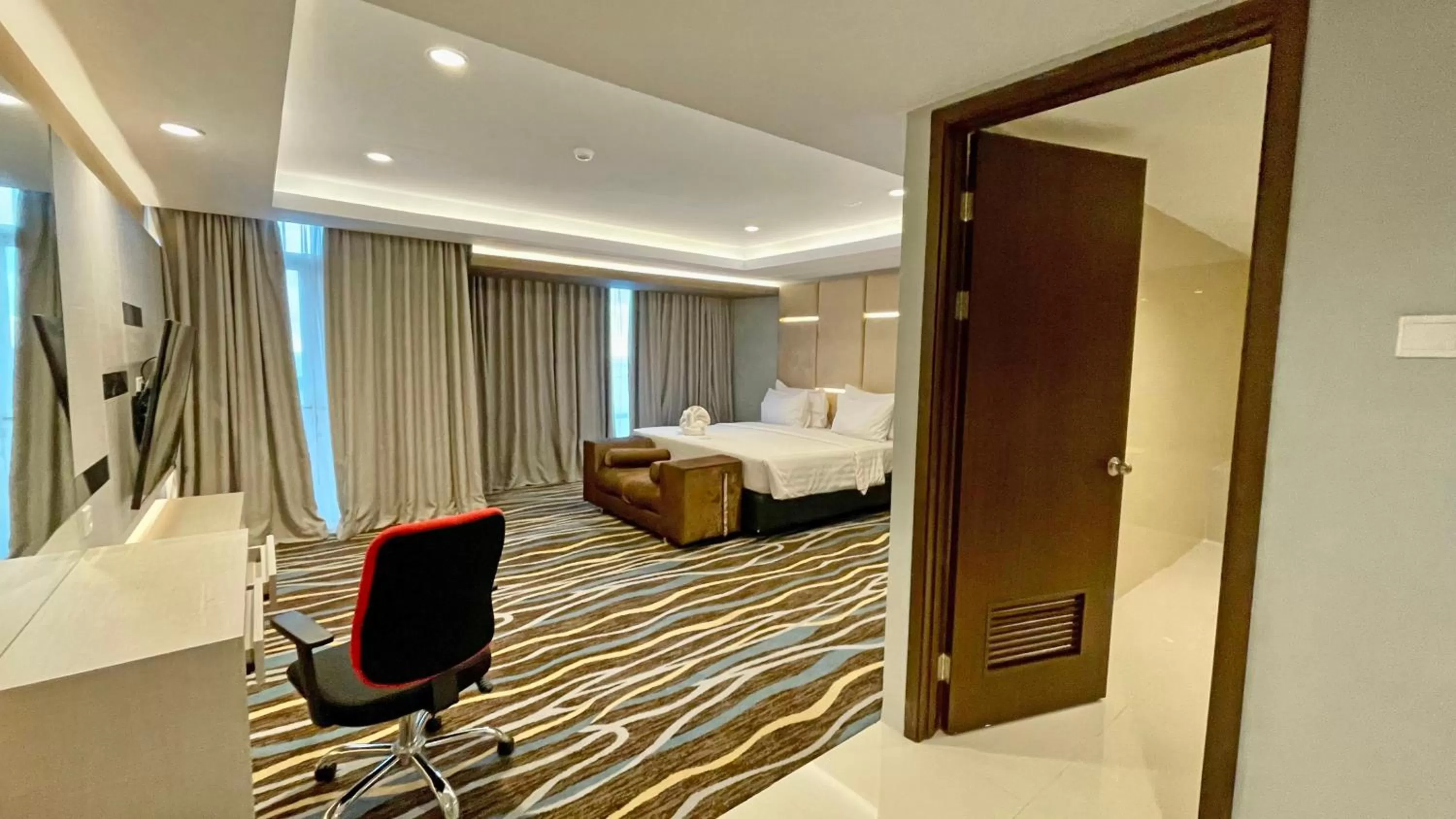 Photo of the whole room, Bed in Swiss-Belhotel Makassar