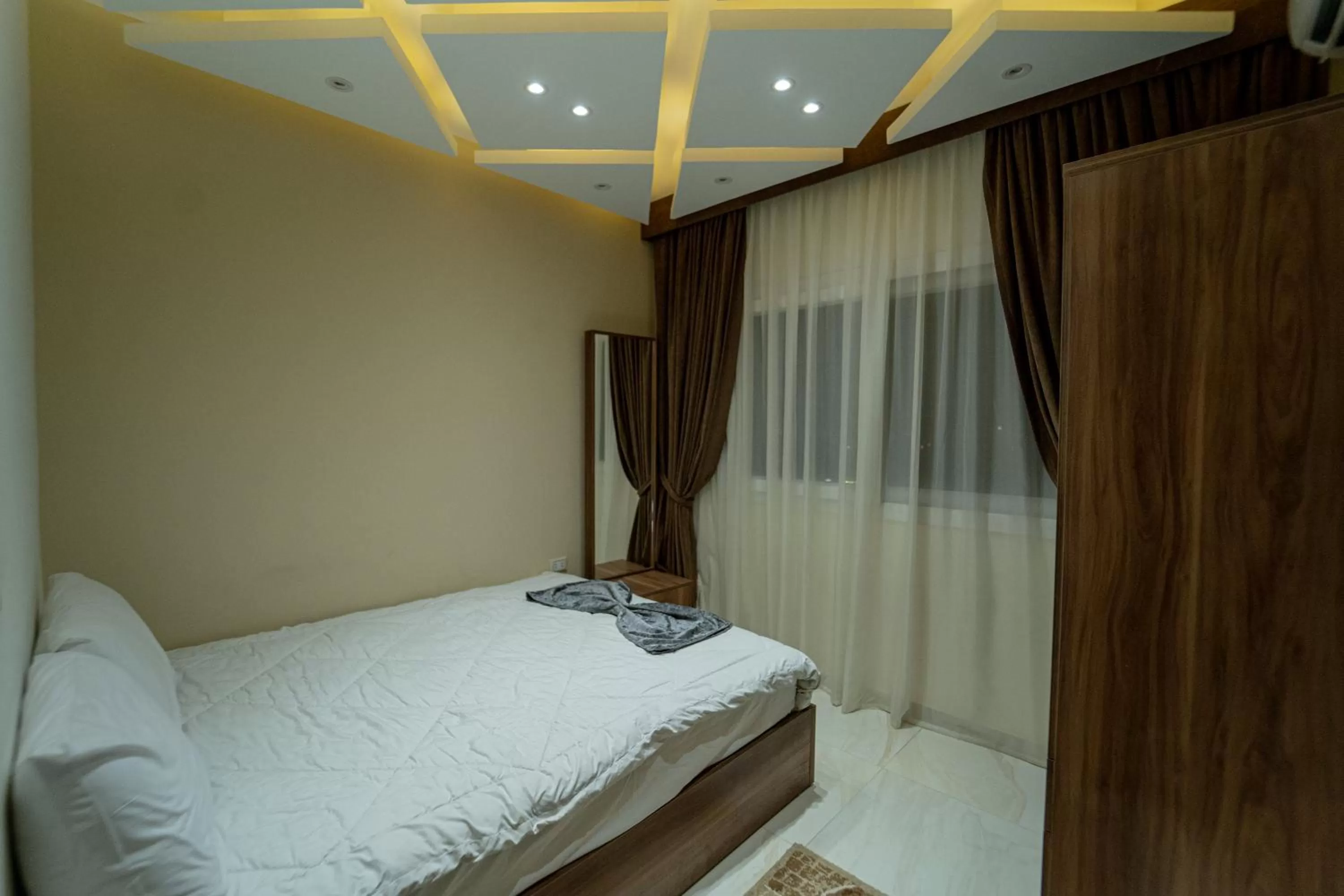 Bed in Gardenia Inn Hotel