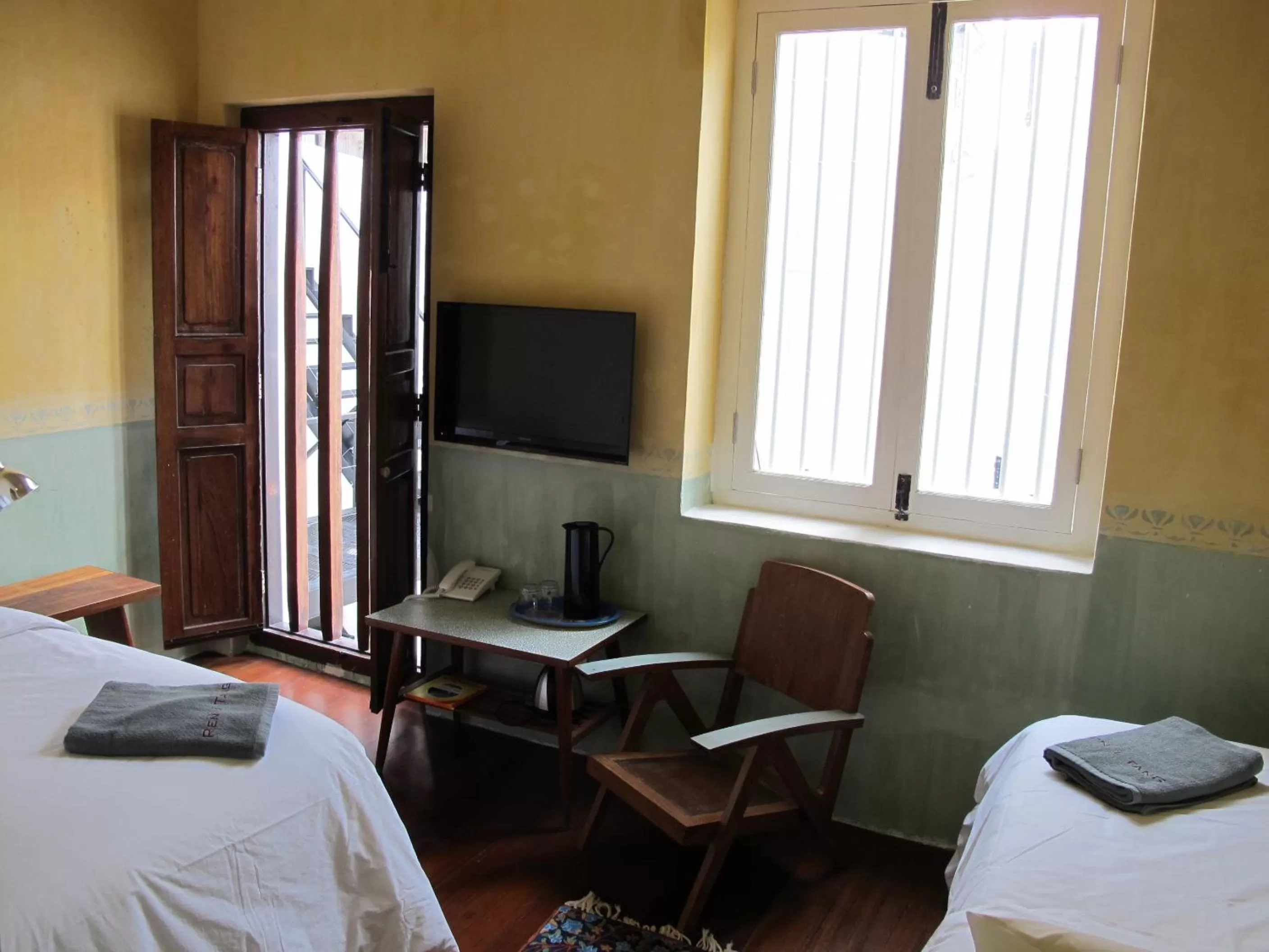 Bed in Ren I Tang Heritage Inn