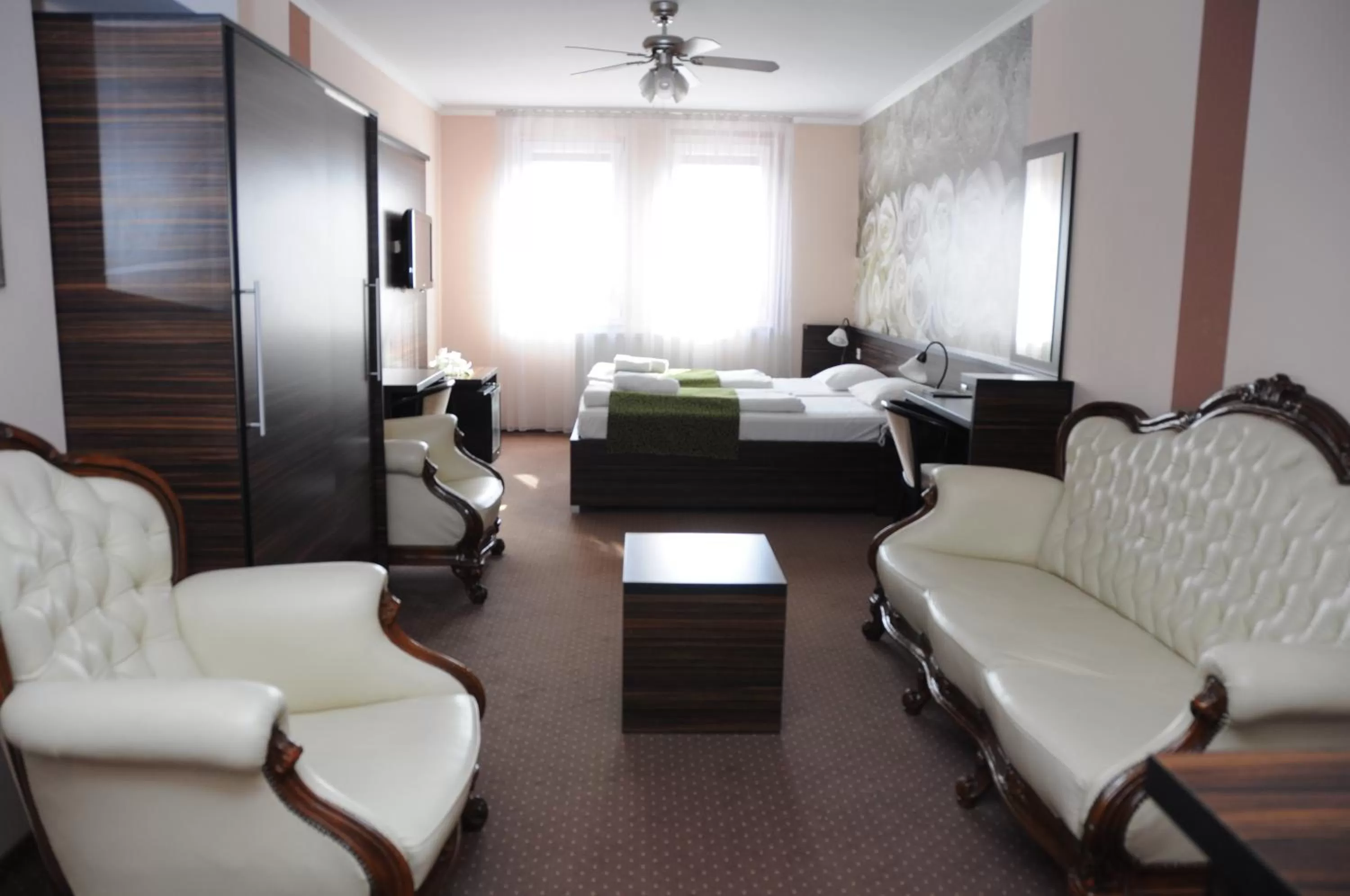 Living room, Bed in Green Hotel Budapest