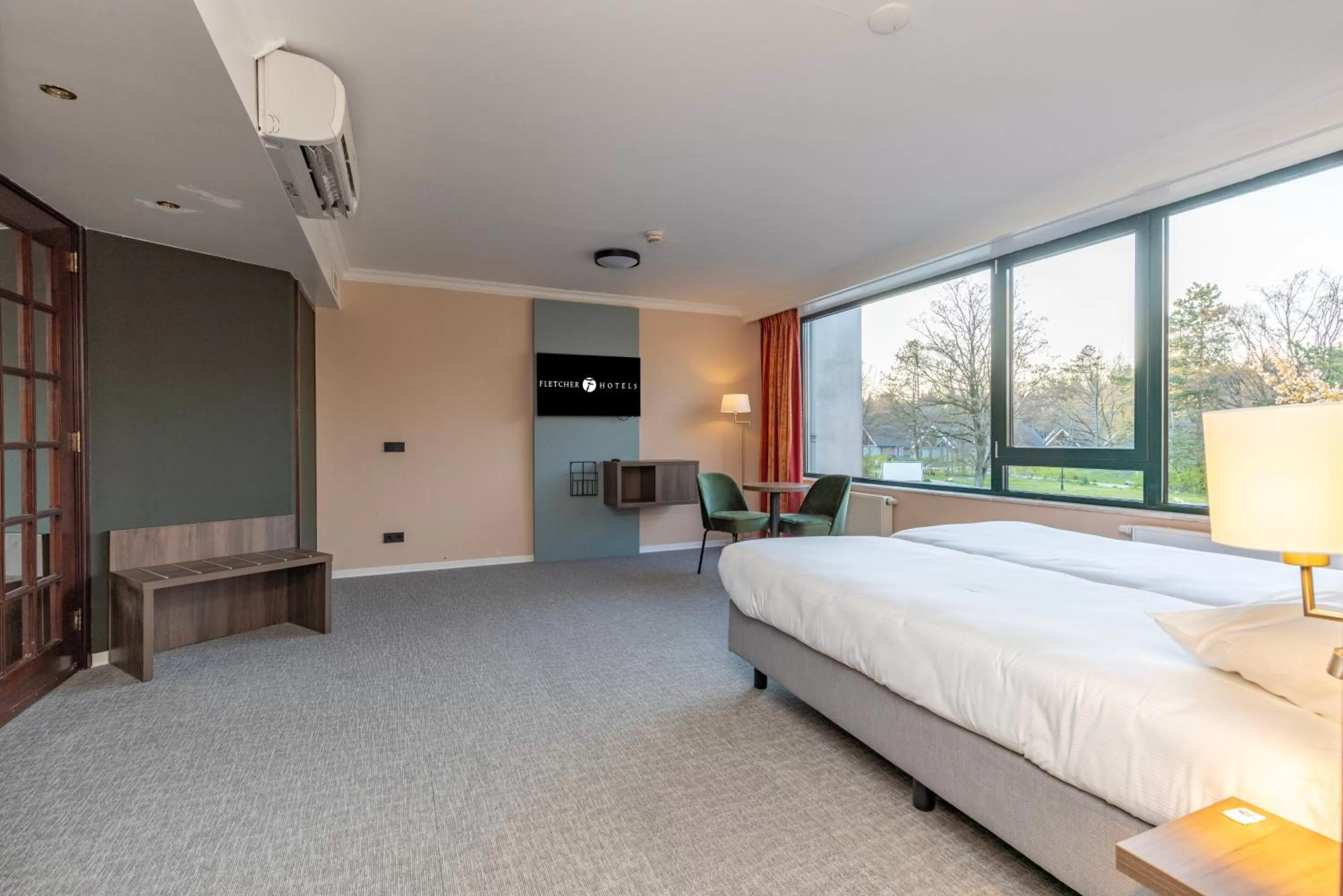 Bed in Fletcher Familiehotel De Hunzebergen