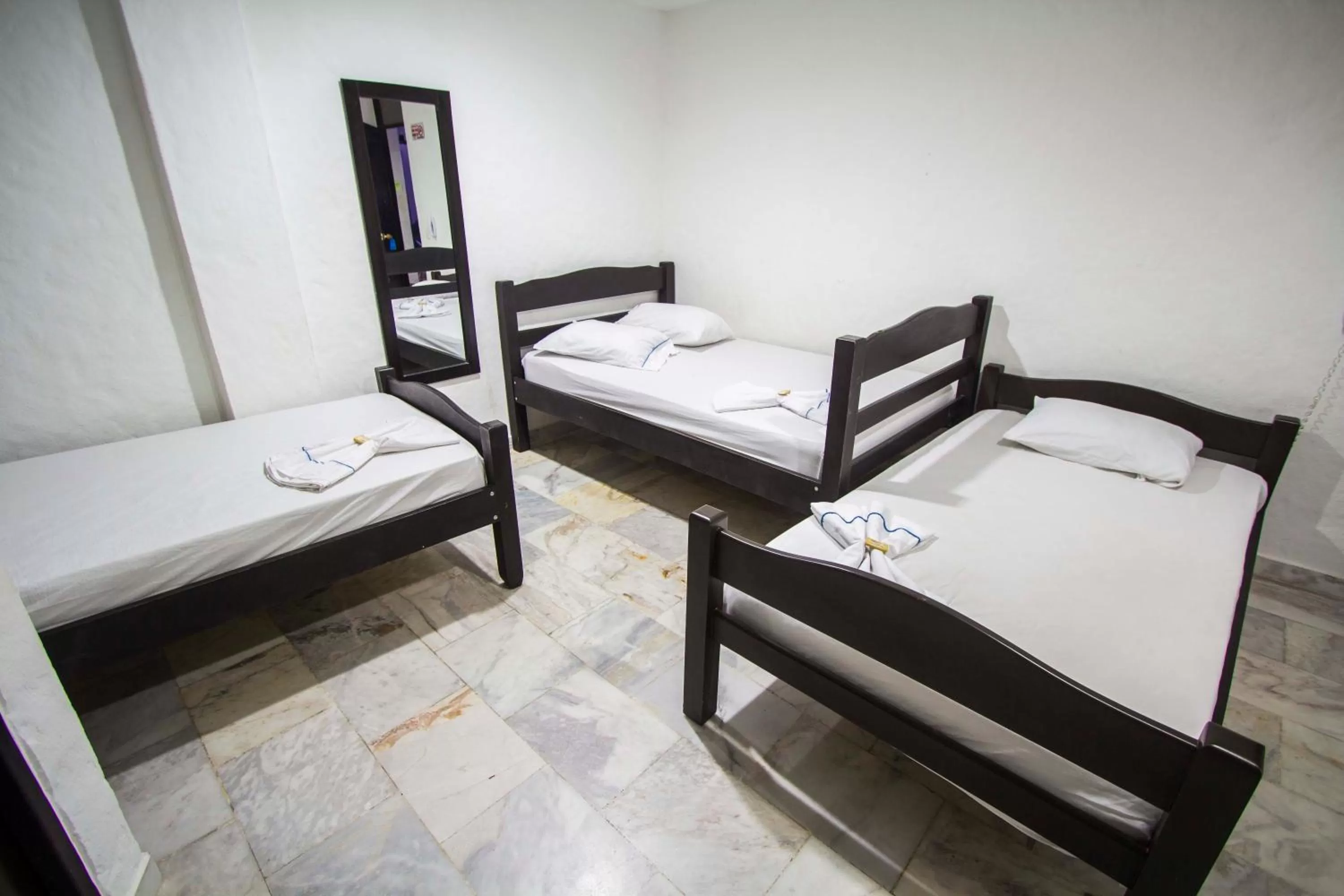 Bed in Blue Star Hotel