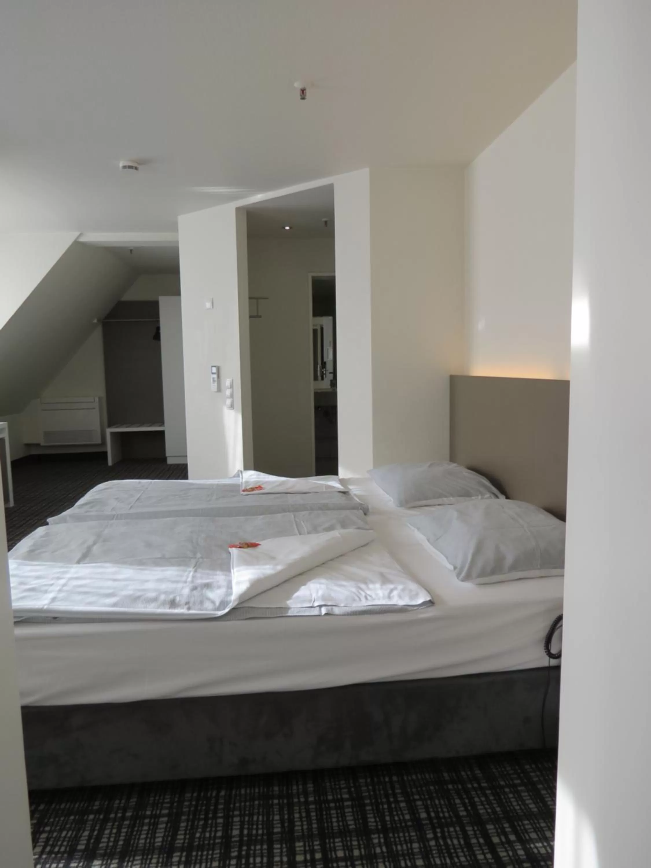 Bed in Comfor Hotel Ulm City