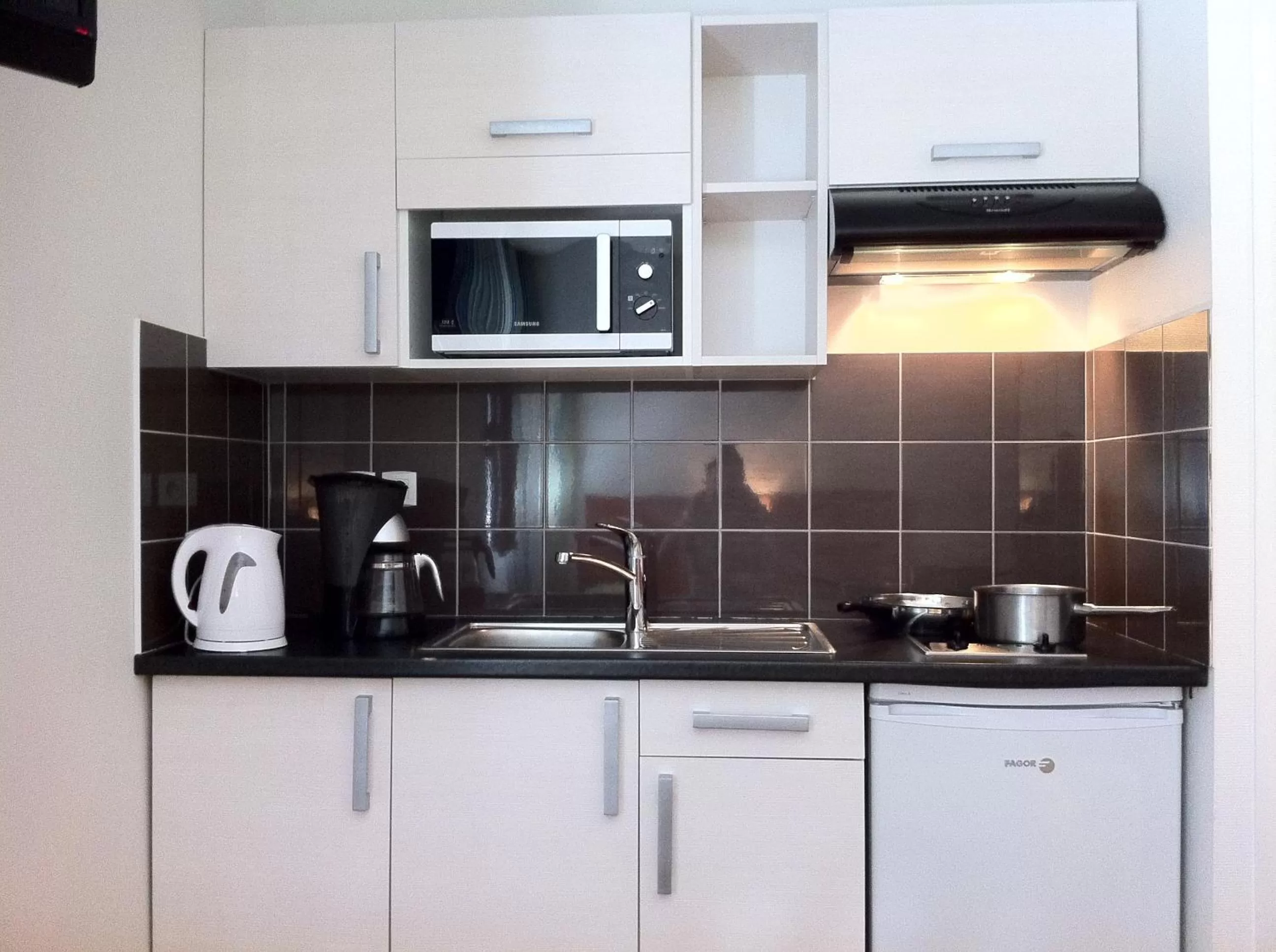 Kitchen or kitchenette in Résidence du Soleil