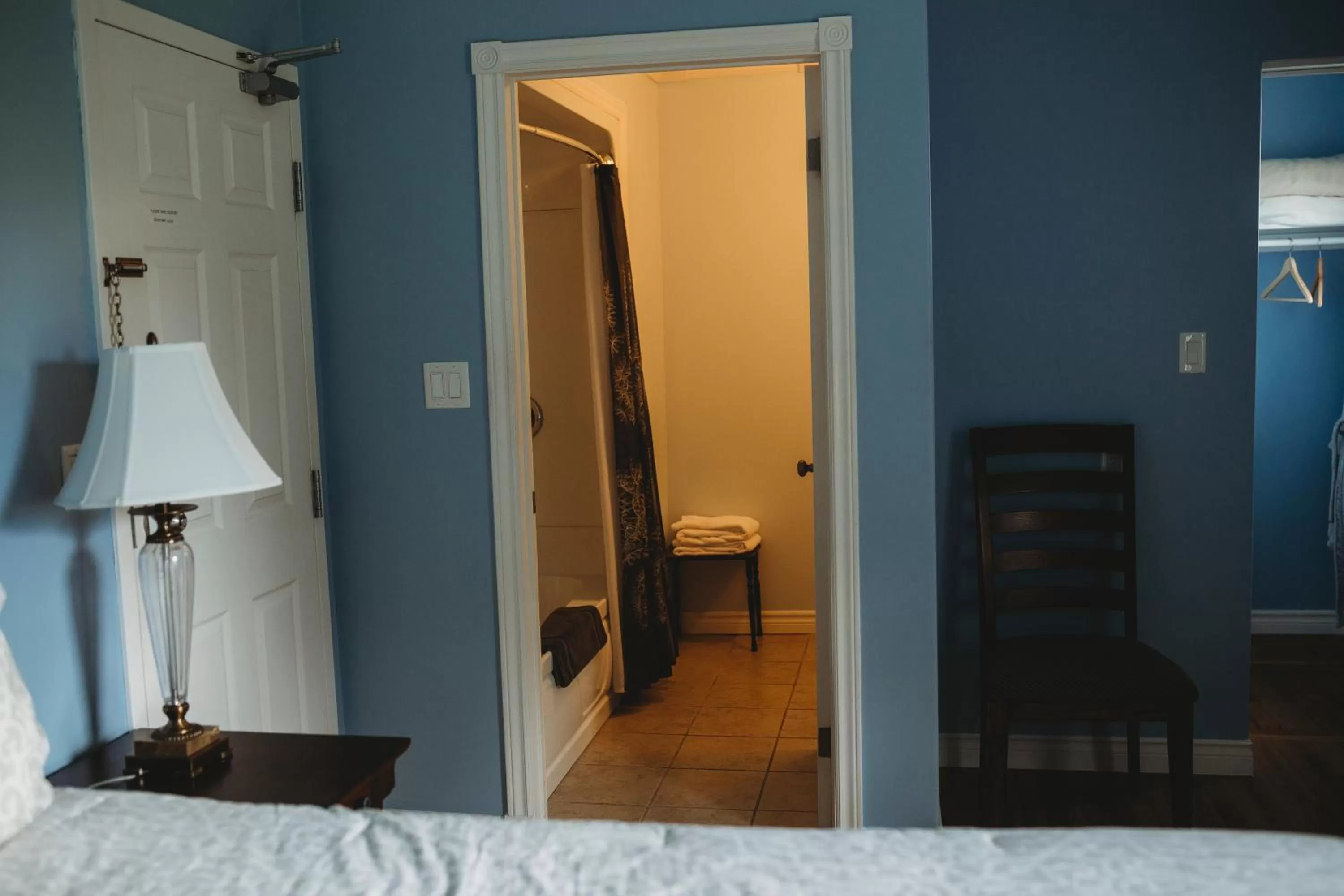 Bathroom, Bed in Carriage House Inn Four and a Half Stars