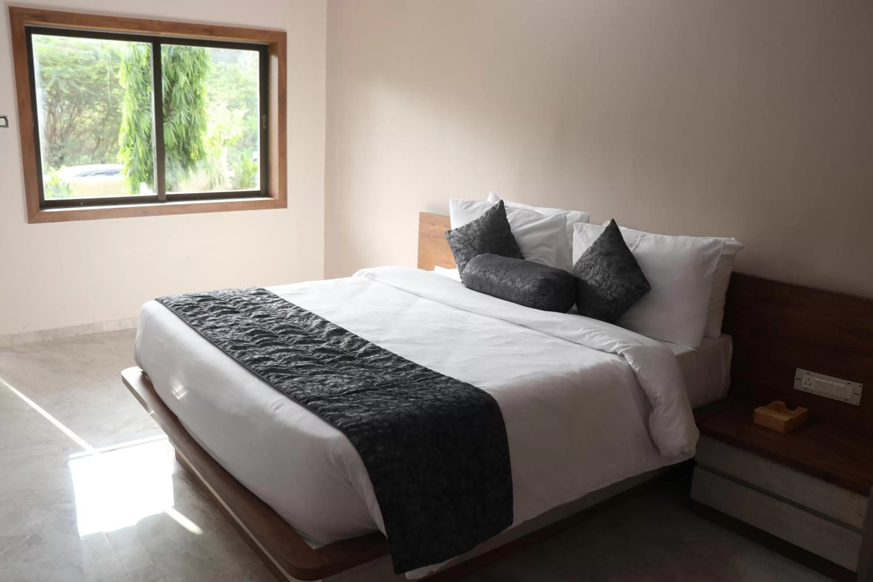 Bed in Nest Beacon Resort Daman