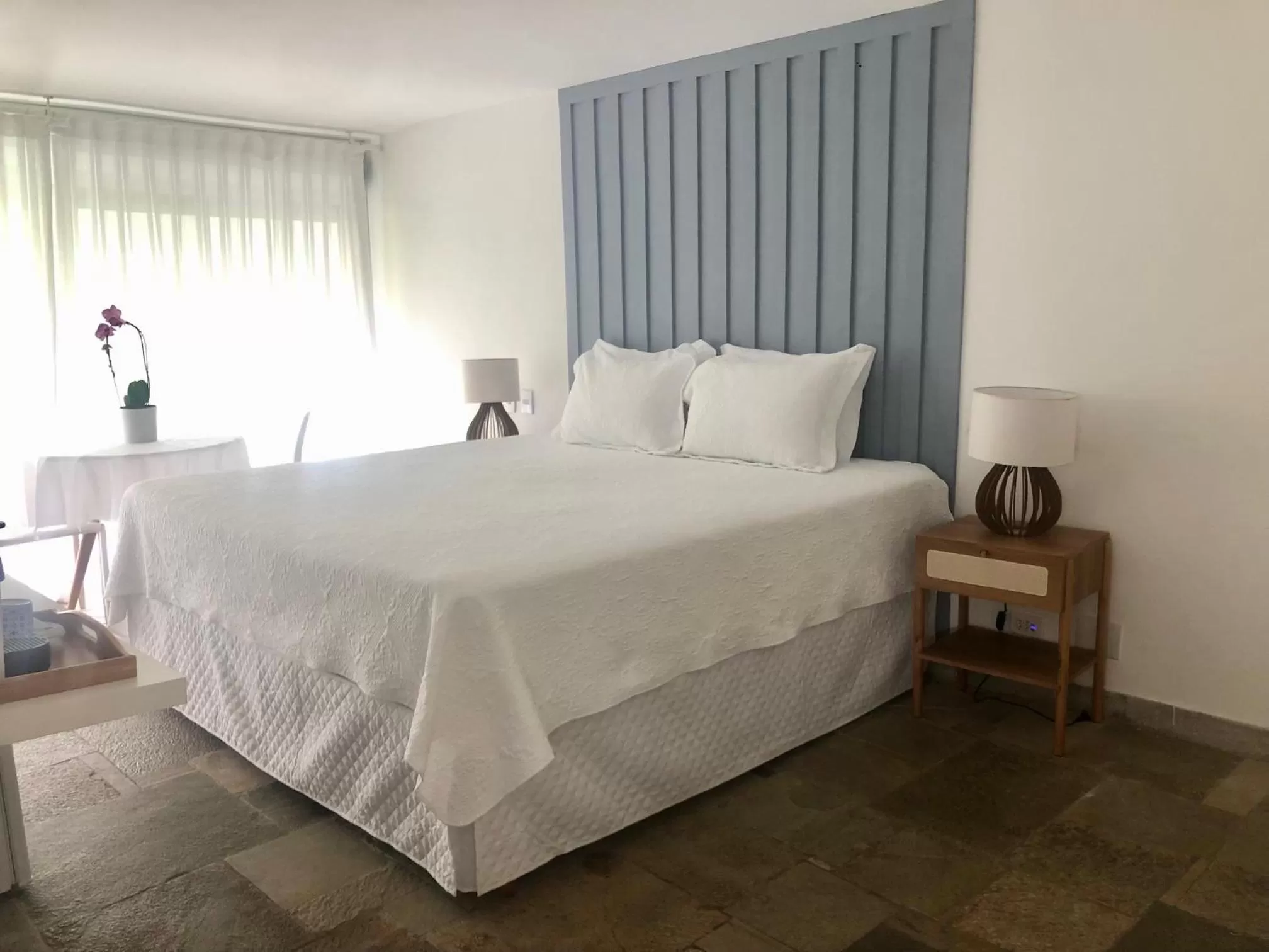 Bed in Guest House Guarujá