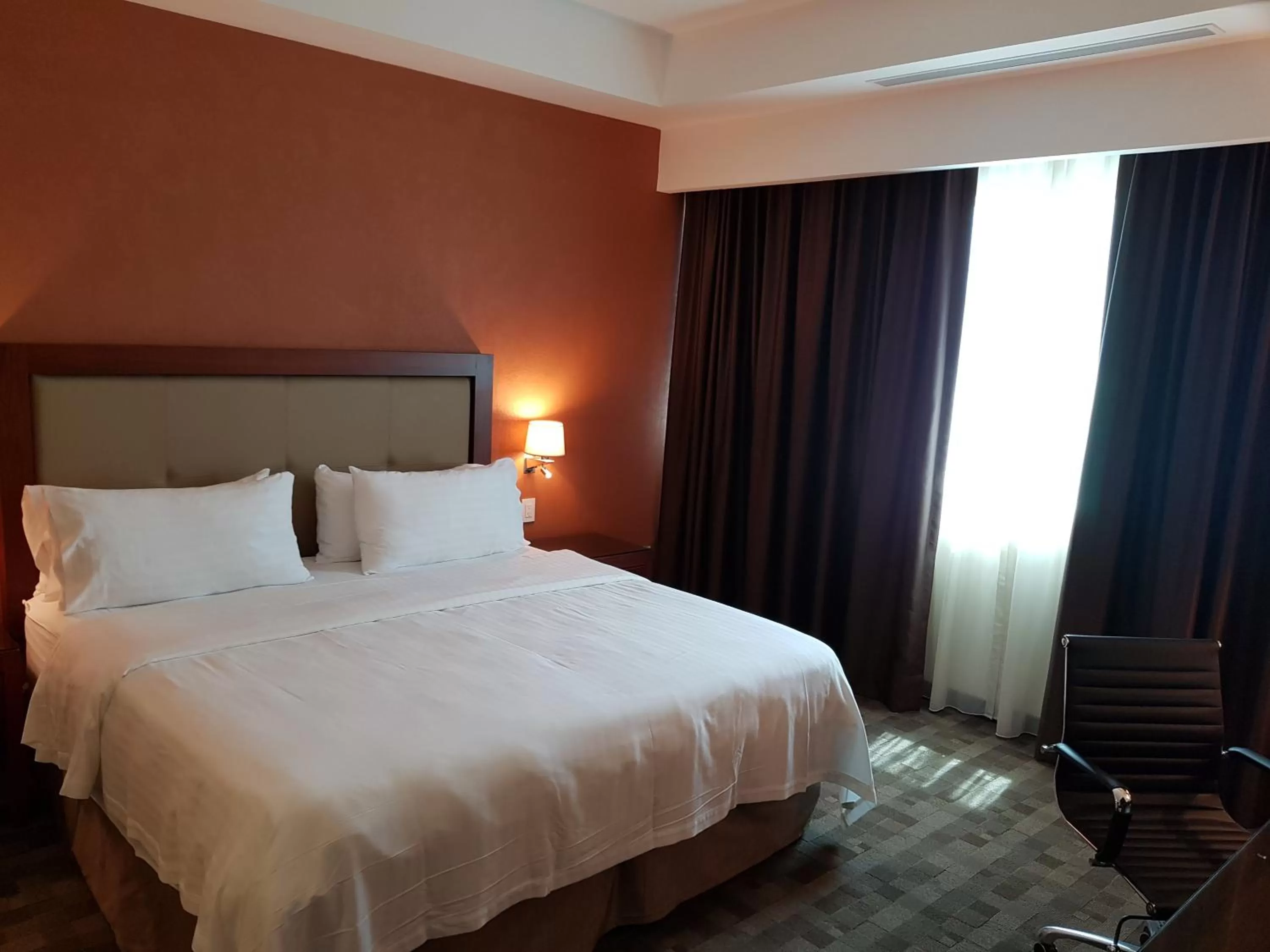 Photo of the whole room, Bed in Holiday Inn & Suites Plaza Mayor by IHG