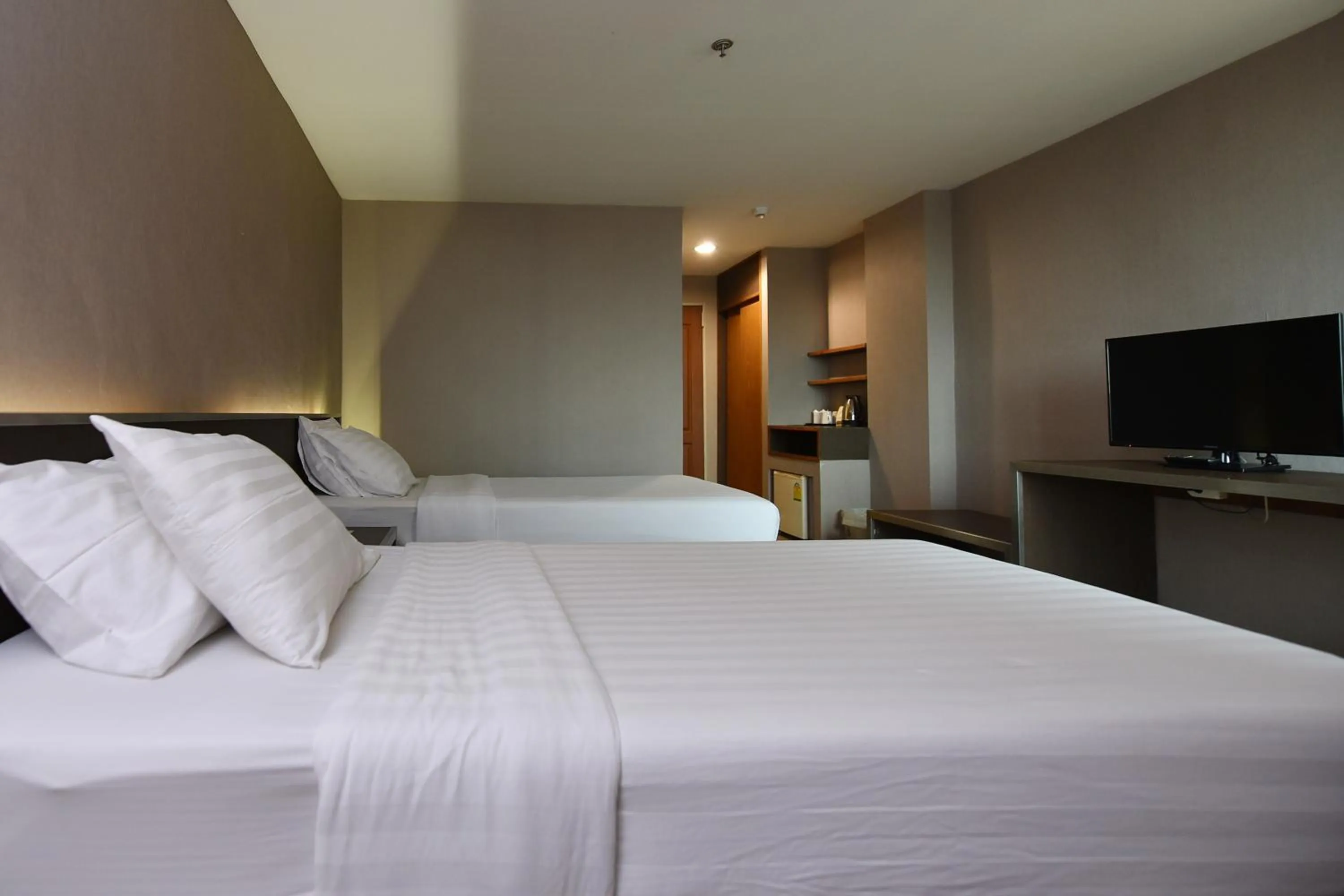 Bed in Bangkok City Suite