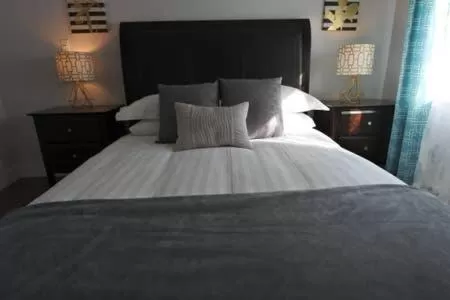Bed in Black Rooster Guesthouse