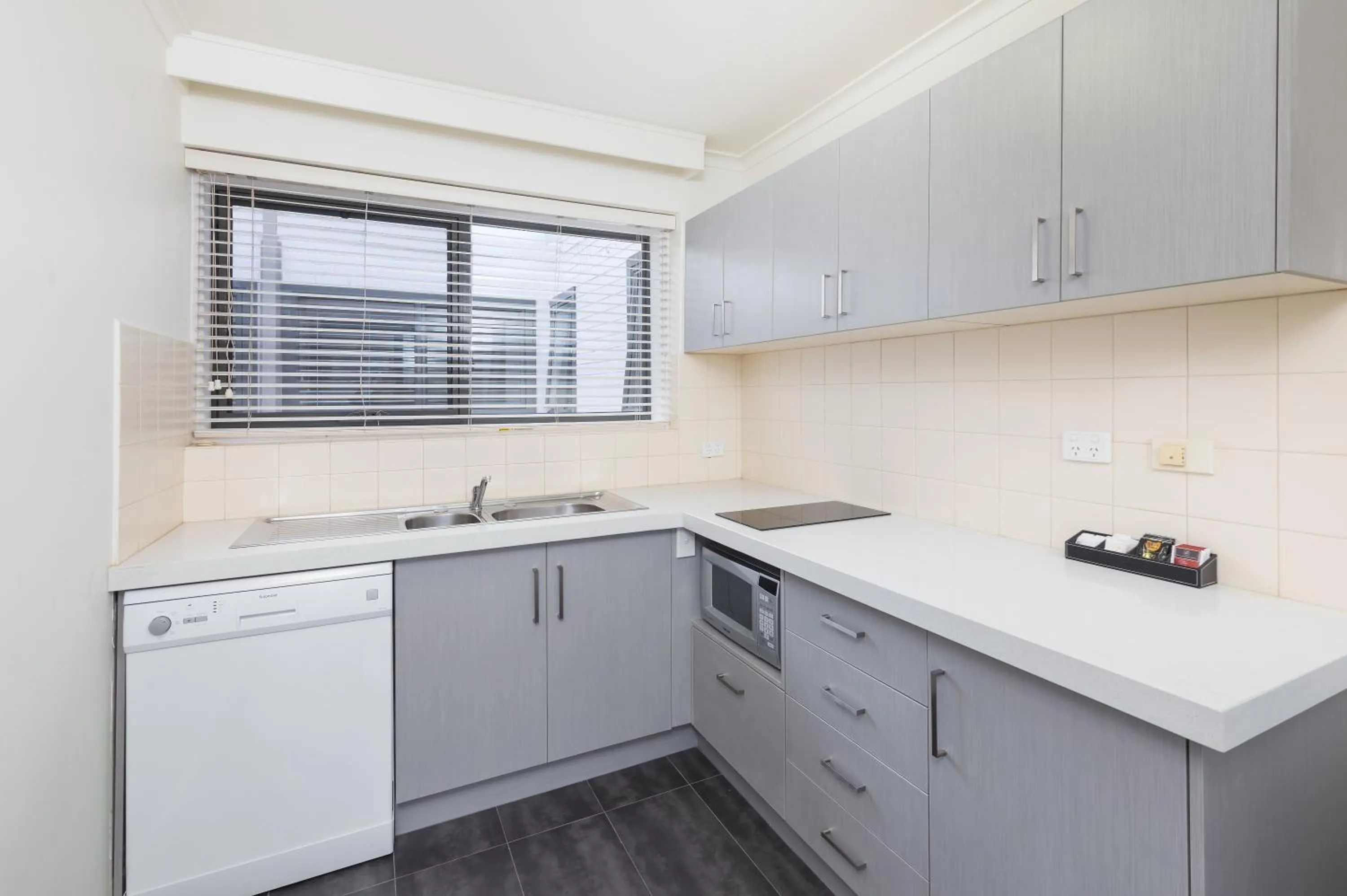 Kitchen or kitchenette in City Edge East Melbourne Apartment Hotel