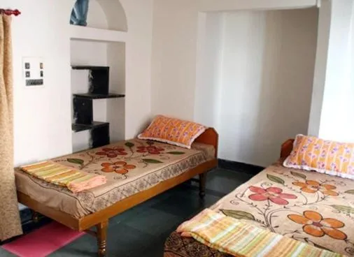 Bed in Udai Haveli Guest House